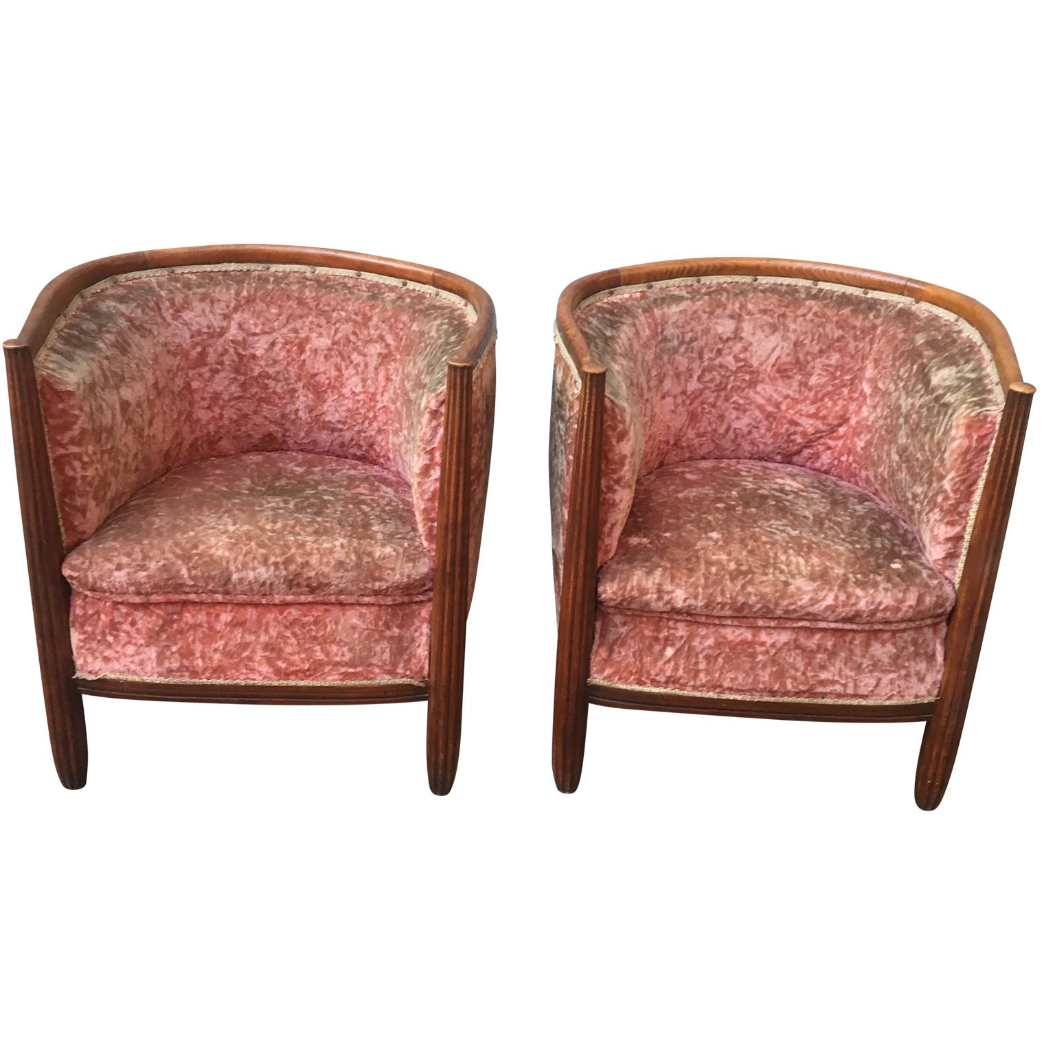 Pair of French Art Deco barrel club chairs in original pink velvet fabric.