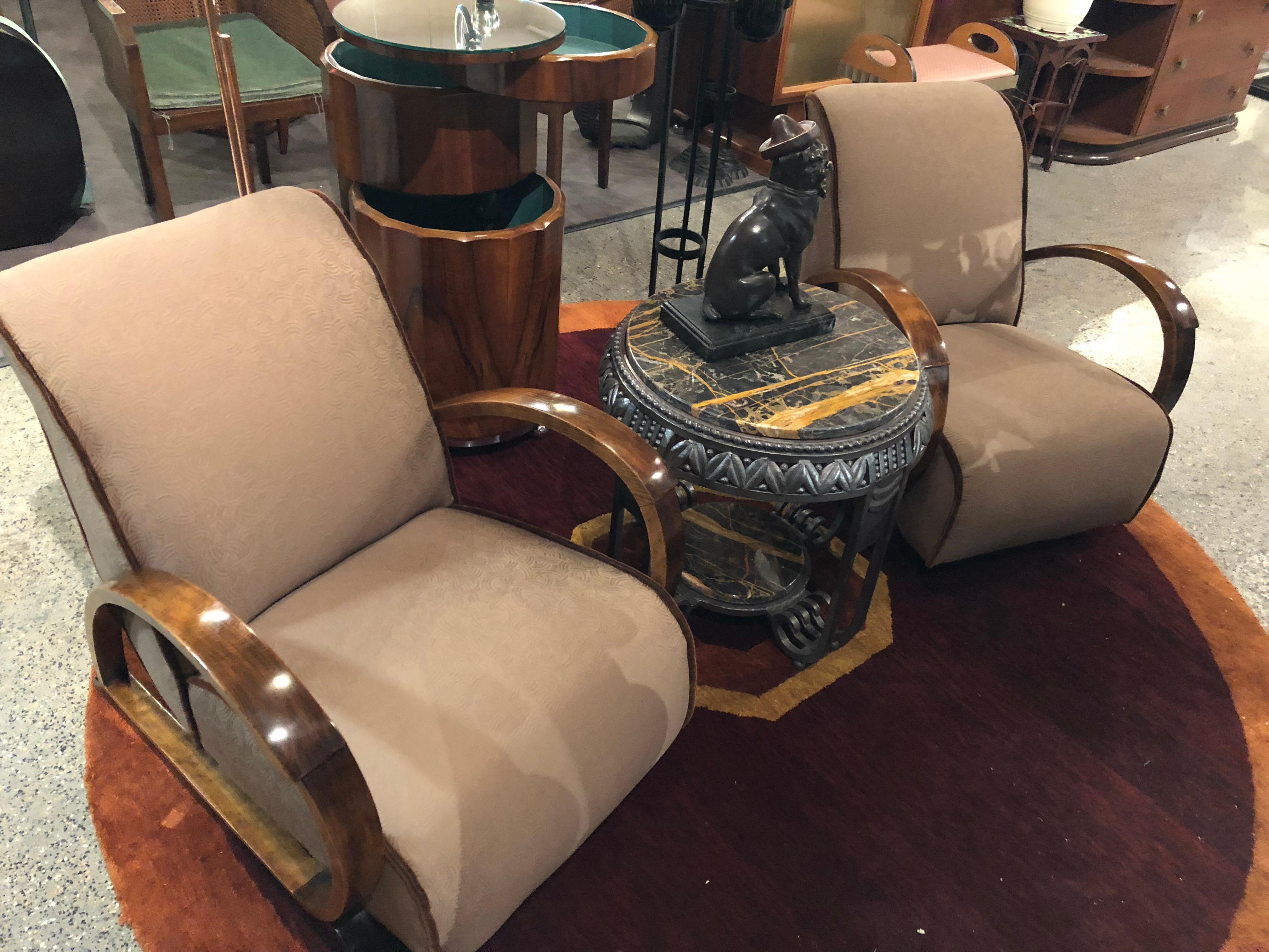 Bentwood split front Art Deco reclining chairs. Newly restored in a creamy beige embossed style art deco fabric with oversized brown mohair piping. Very comfortable laid back seating with circular streamline style solid wood arms. Would look just