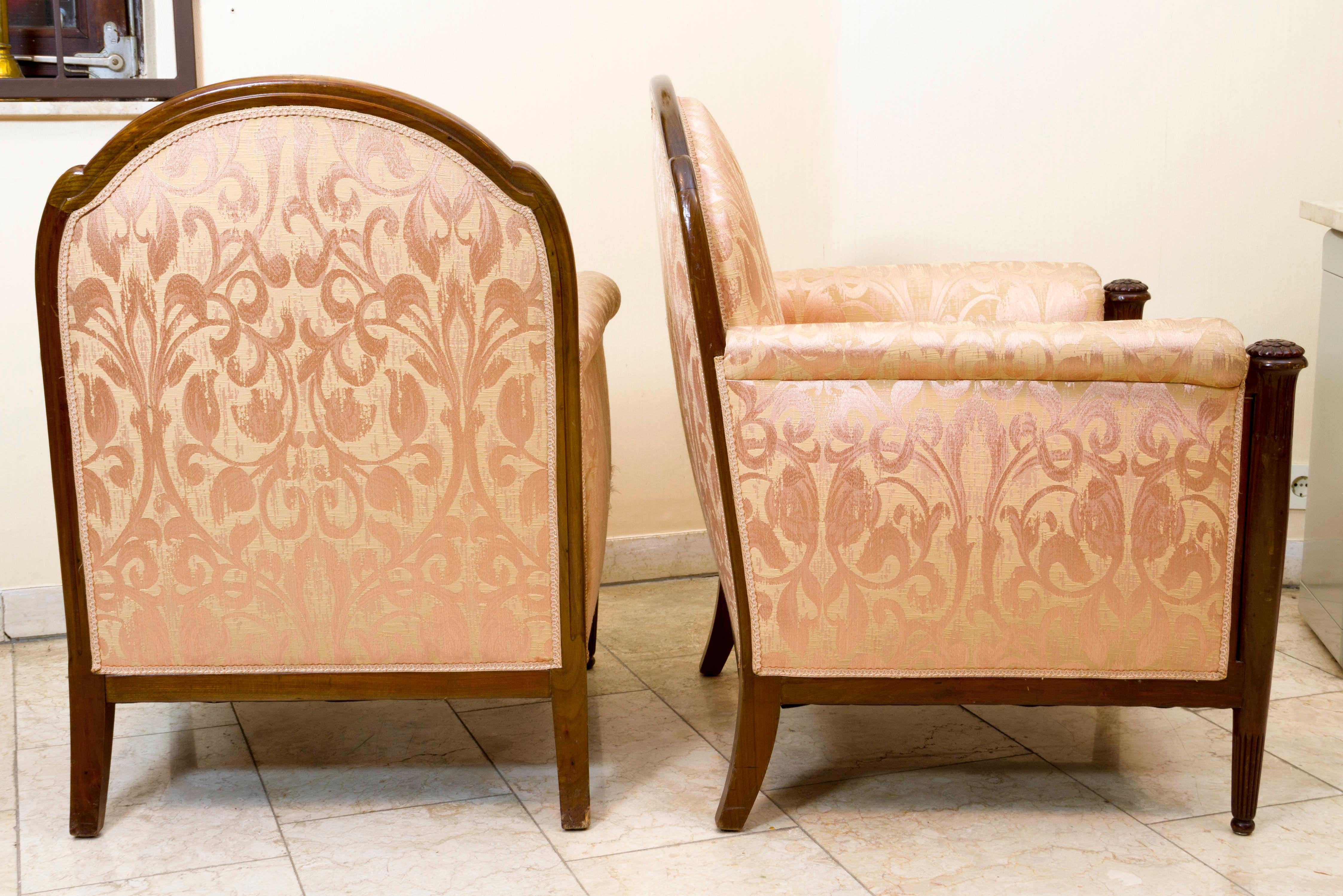 Rare pair of Bergeres by Paul Follot
Frame of massive mahogany, finely sculpted 
Upholstered with rose silk.