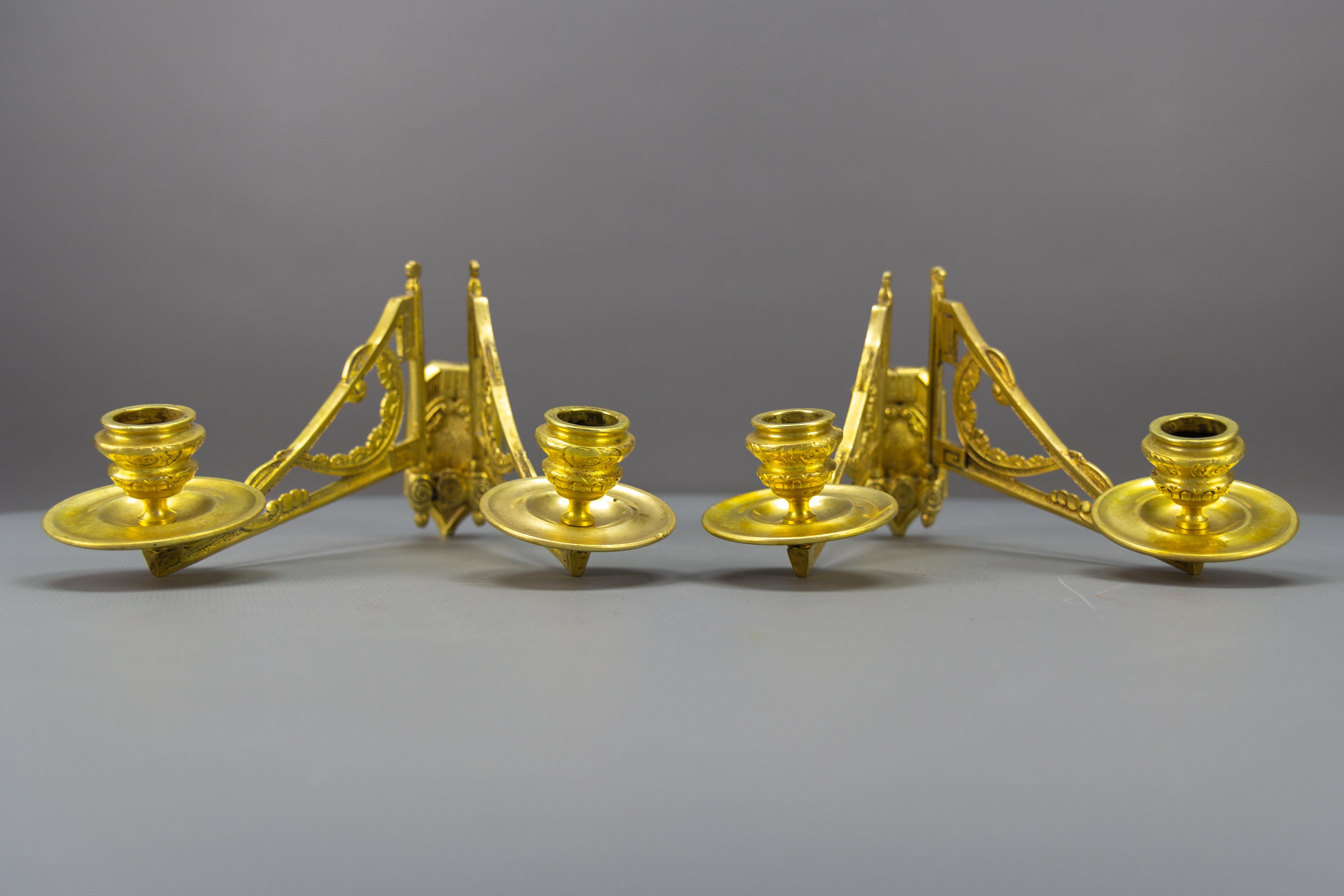 A pair of Art Deco ornate piano or wall lights, candleholders by Leon Pinet. Each sconce has two arms, each for one candle, with beautiful Art Deco flower motifs. Numbered and marked L. Pinet on the back side, France, ca 1930.
Dimensions: Height 14