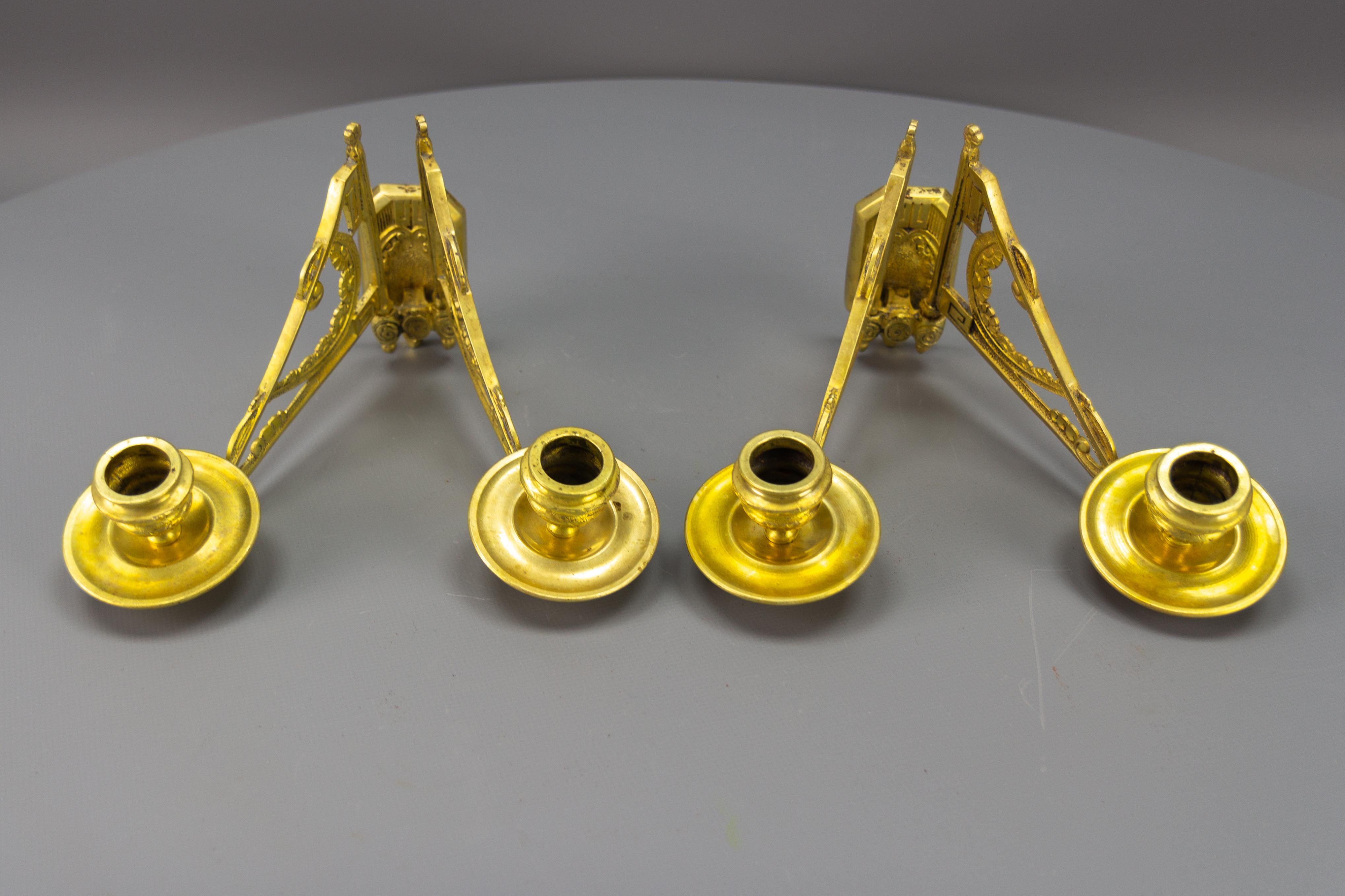 Mid-20th Century Pair of French Art Deco Brass Twin Arm Piano Candlestick Wall Lights by L. Pinet For Sale