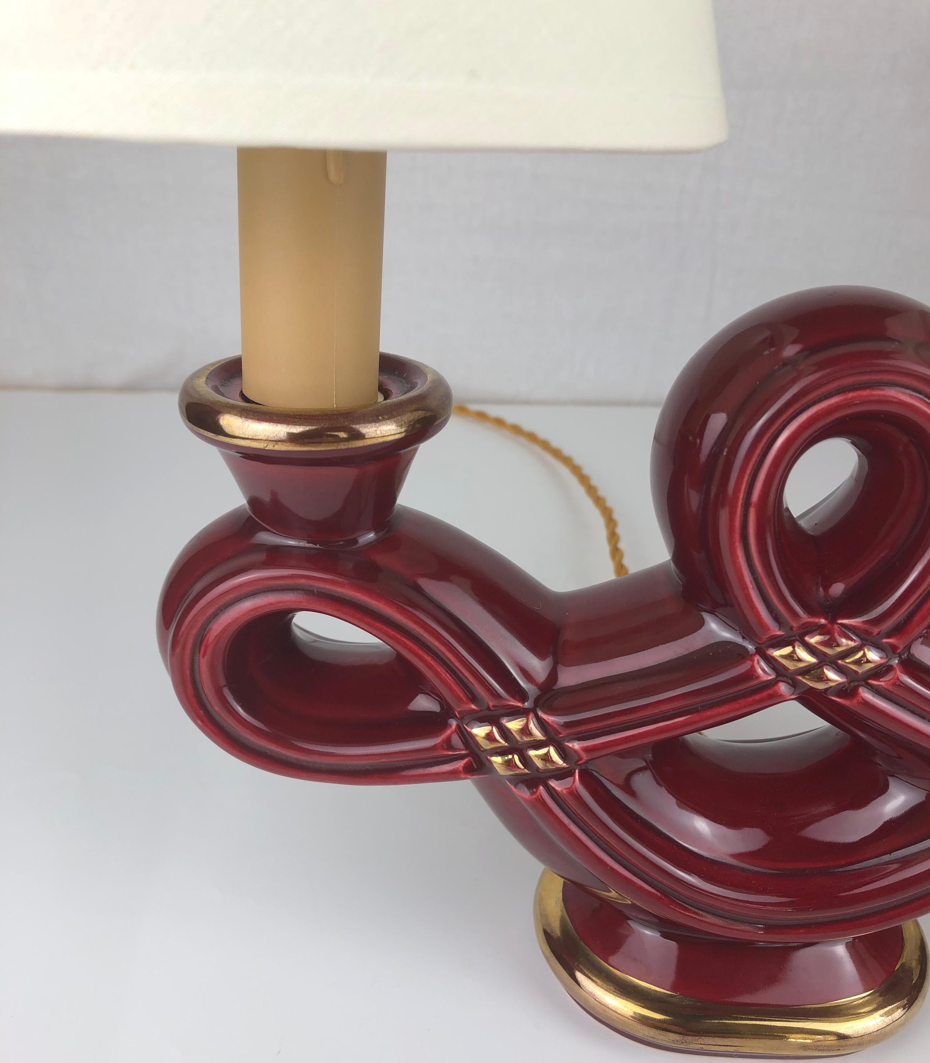 Gilt Pair of French Art Deco Burgundy and Gold Trimmed Swirled Faience Table Lamps For Sale
