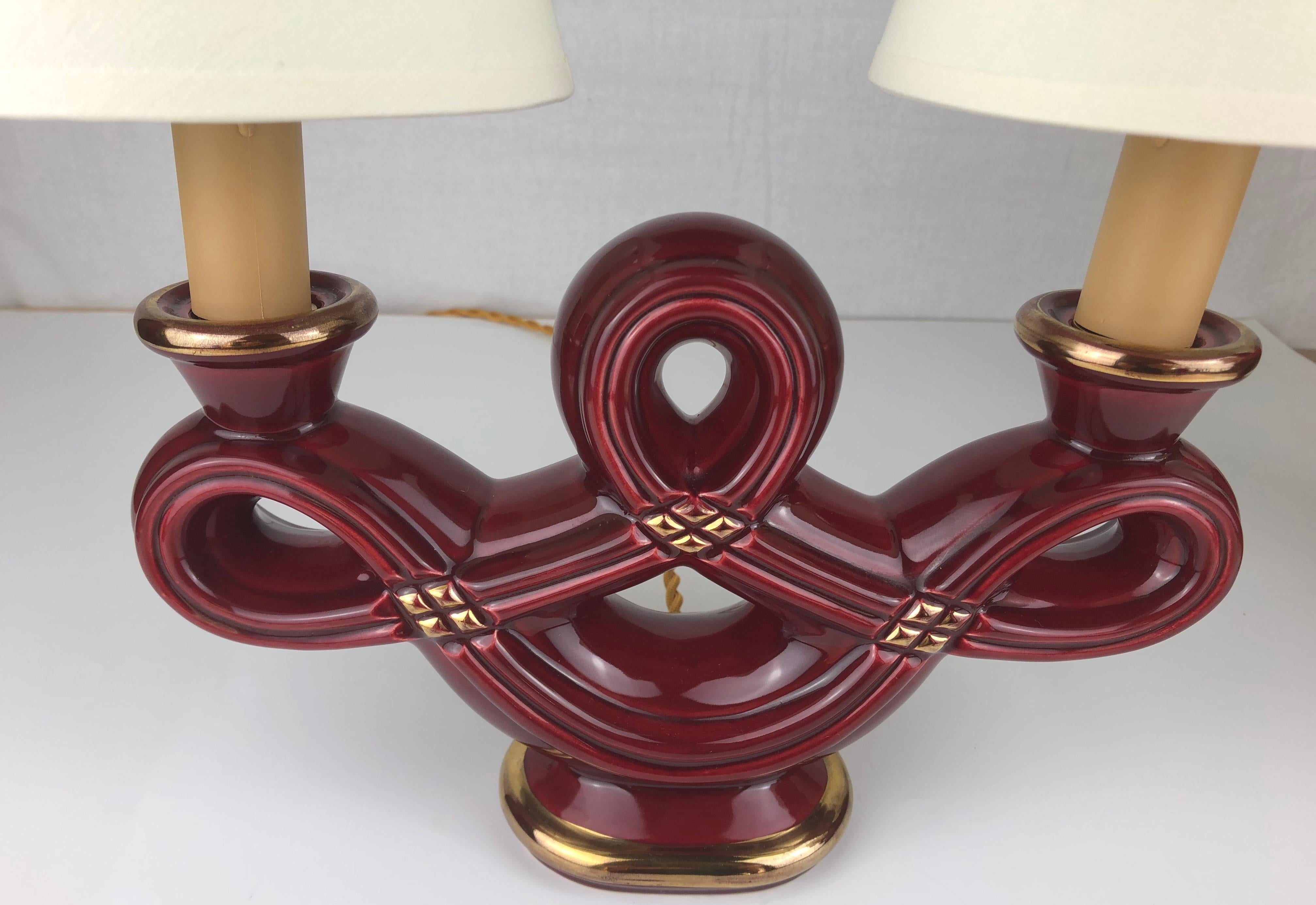 20th Century Pair of French Art Deco Burgundy and Gold Trimmed Swirled Faience Table Lamps For Sale