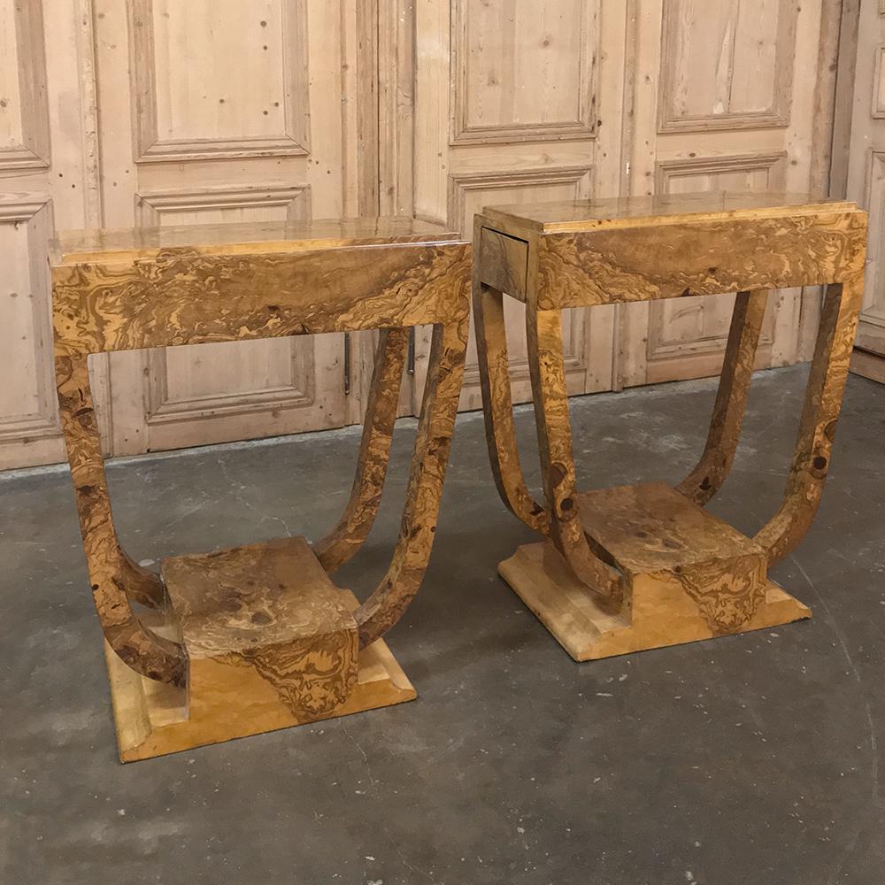 Pair of Art Deco burl walnut end tables are an amazing example of the sleek curving lines of the style that ushered in the jet age! This example features the exotic naturalistic appearance of the beautiful wood grain, coupled with an iconic design