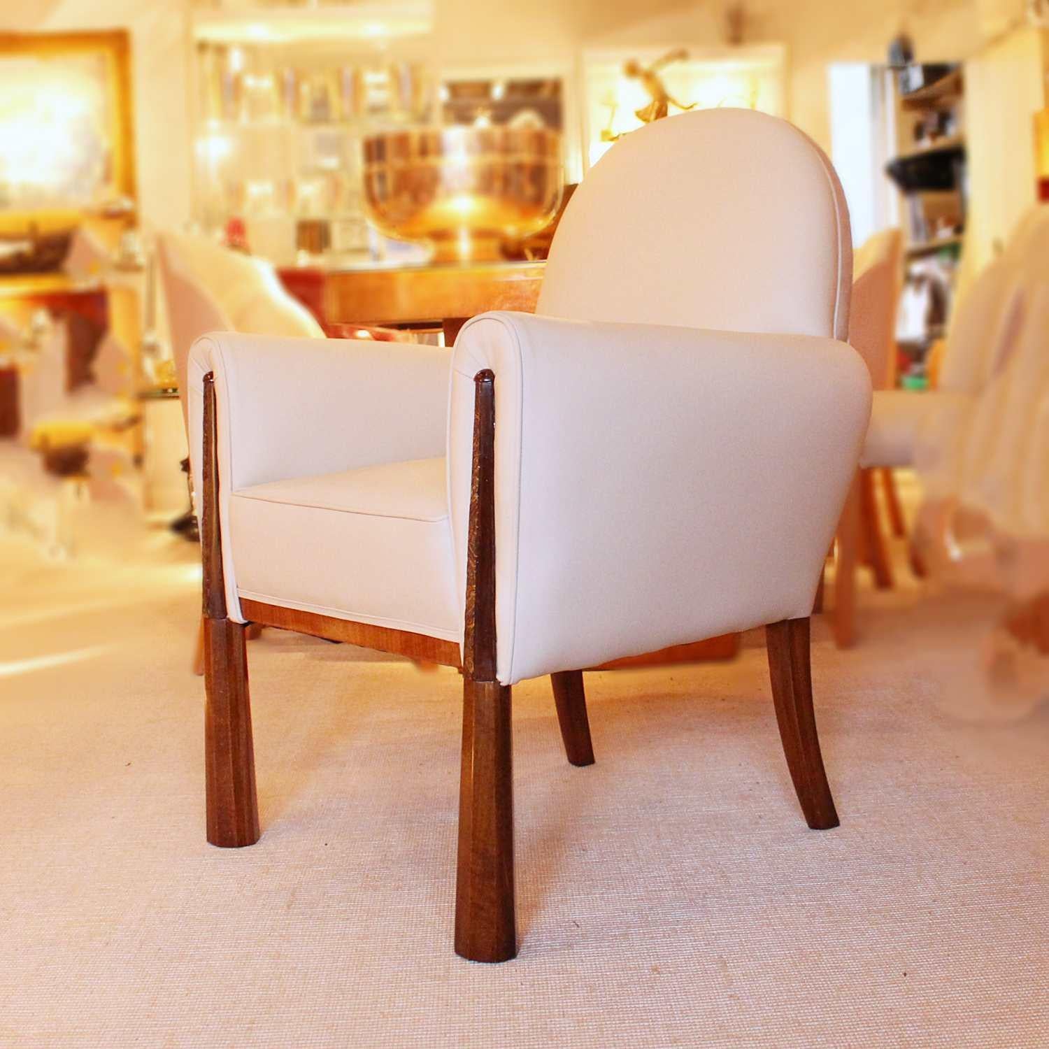 A pair of Art Deco chairs, with shaped, carved solid walnut legs. Upholstered in cream leather and Alcantara suede.




 