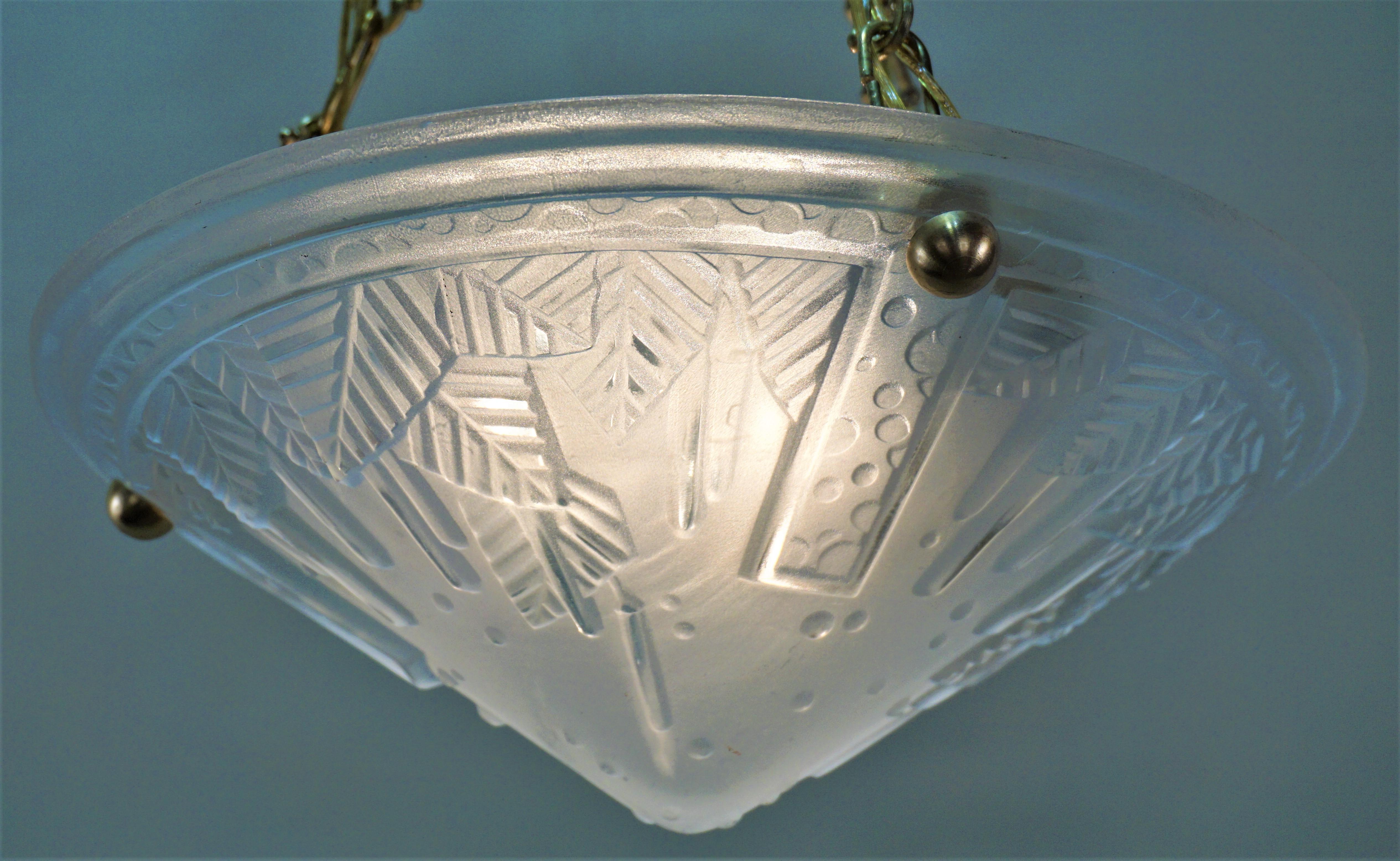 Pair of French Art Deco clear frost glass ceiling Light with bronze hardware.
Three lights, 60 watt each.