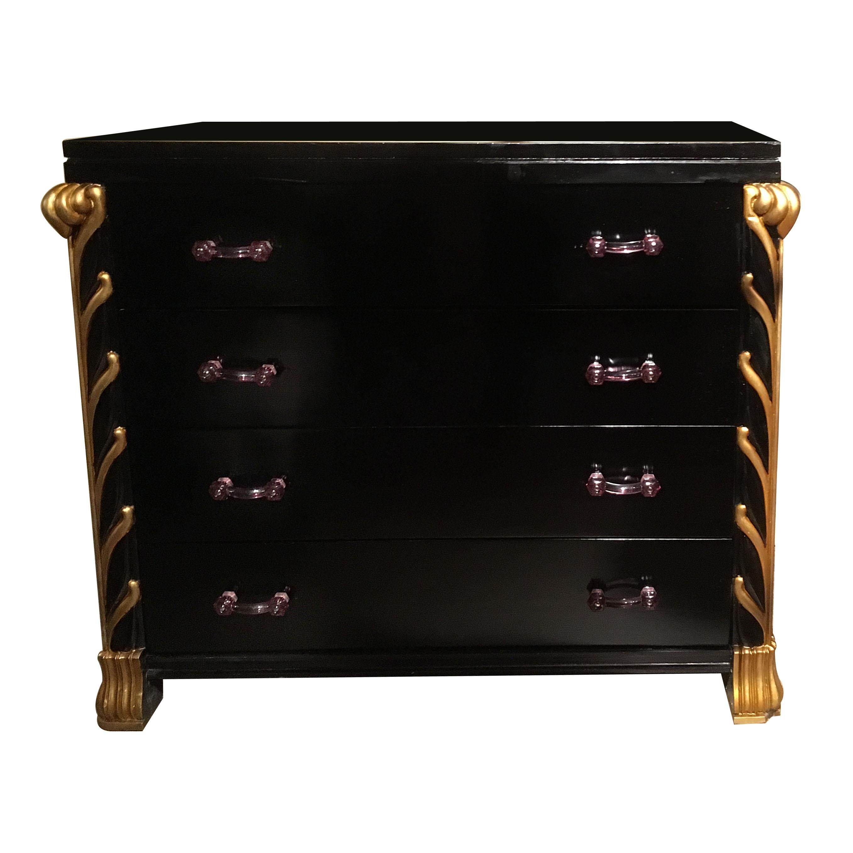 Pair of circa 1940s French black lacquered chests of drawers with gilt details. Amethyst glass pulls.

Measurements:
Width 40