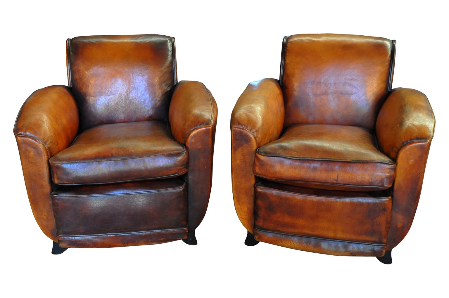 A terrific pair of French Art Deco period club chairs beautifully crafted from leather. Very classic and elegant lines.