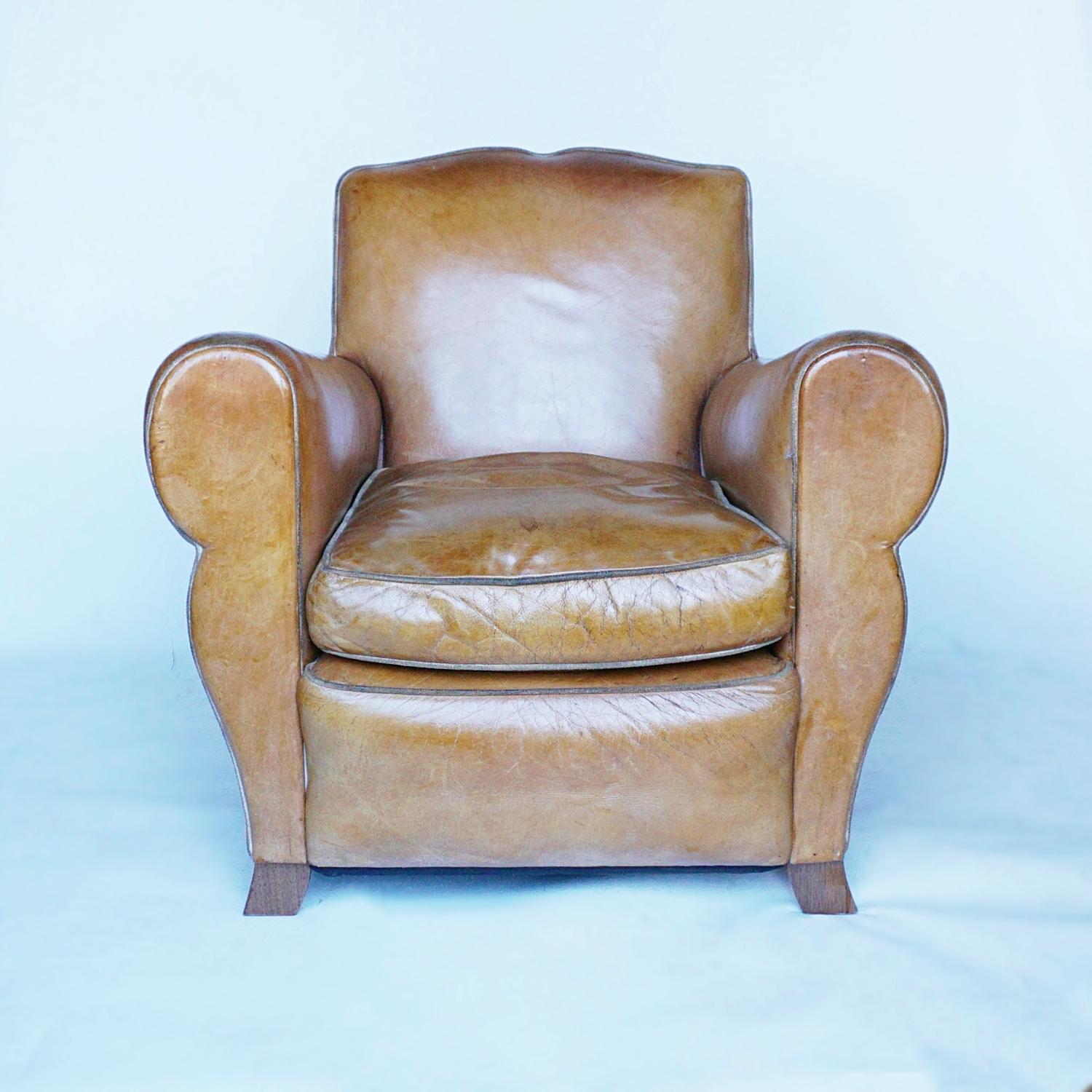 Pair of French Art Deco Club chairs. Moustache backed with curved shaped legs. Upholstered in brown leather. 

Dimensions: H 72cm W 79cm D 64cm Seat H 40cm 

Origin: French

Date: Circa 1940

Item Number: 212212.