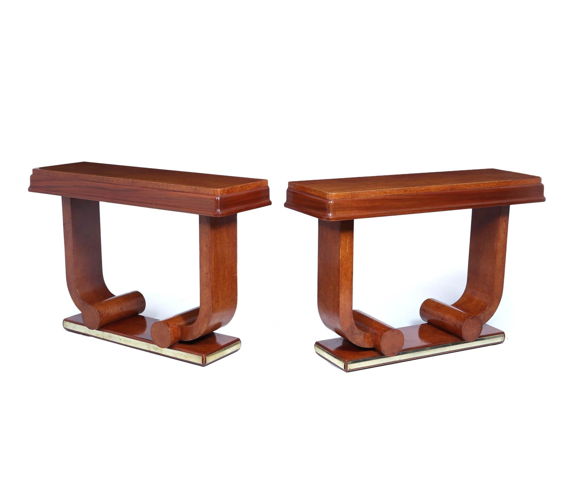 French Art Deco Console Tables 

Introducing a stunning pair of French Art Deco console tables, crafted from exquisite amboyna wood circa 1925, that epitomise elegance and sophistication. Each table boasts a meticulously shaped base and distinctive