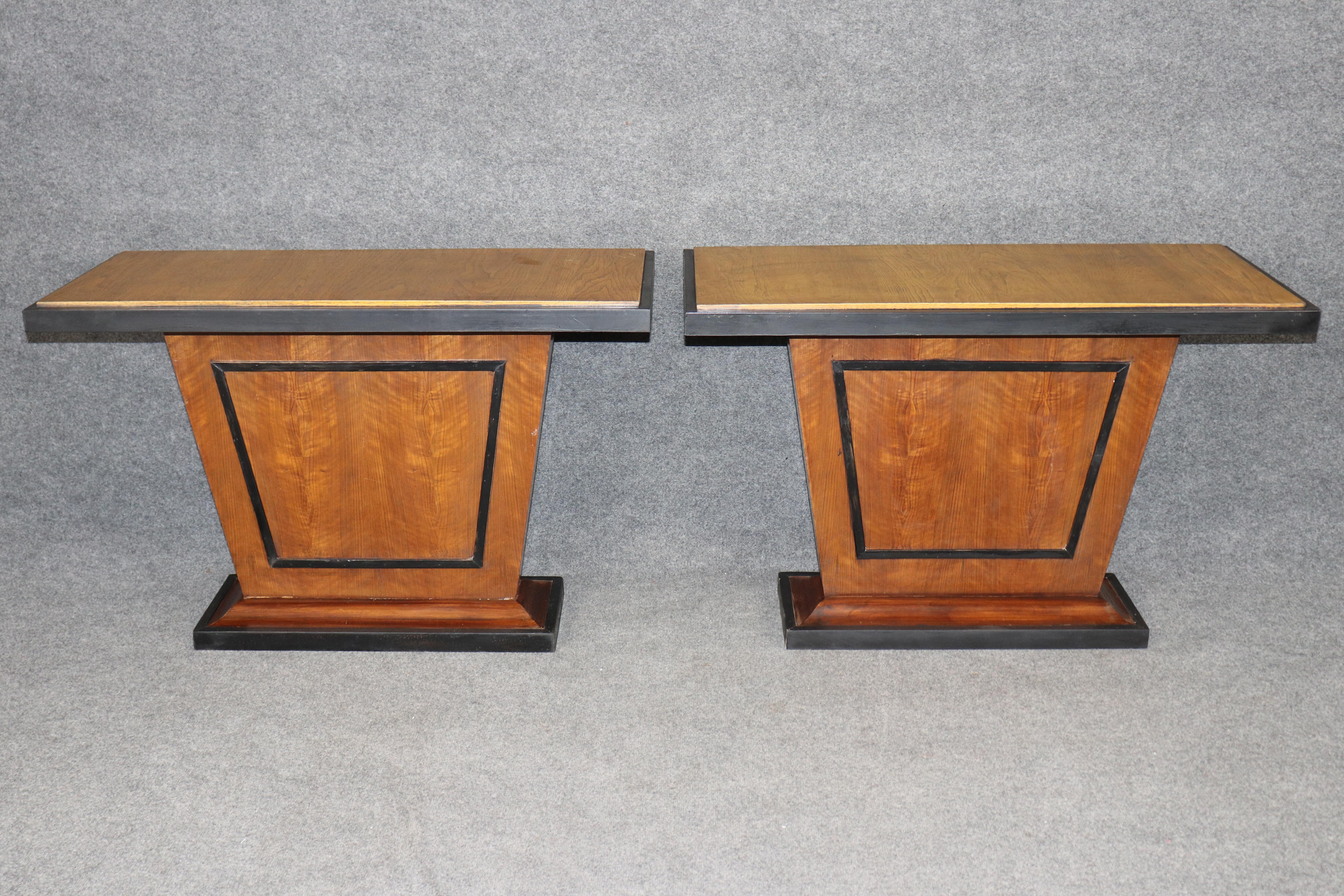 Dimensions - H: 28 1/2 in W: 43 1/2 in D: 18 1/2 in 

An outstanding pair of French Art Deco console tables in the manner of Émile-Jacques Ruhlmann (1879–1933), the celebrated Parisian ébéniste whose name is synonymous with the height of French Art