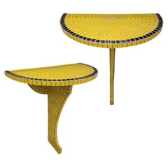 Pair of French art deco consoles, yellow and black glass, wall consoles
