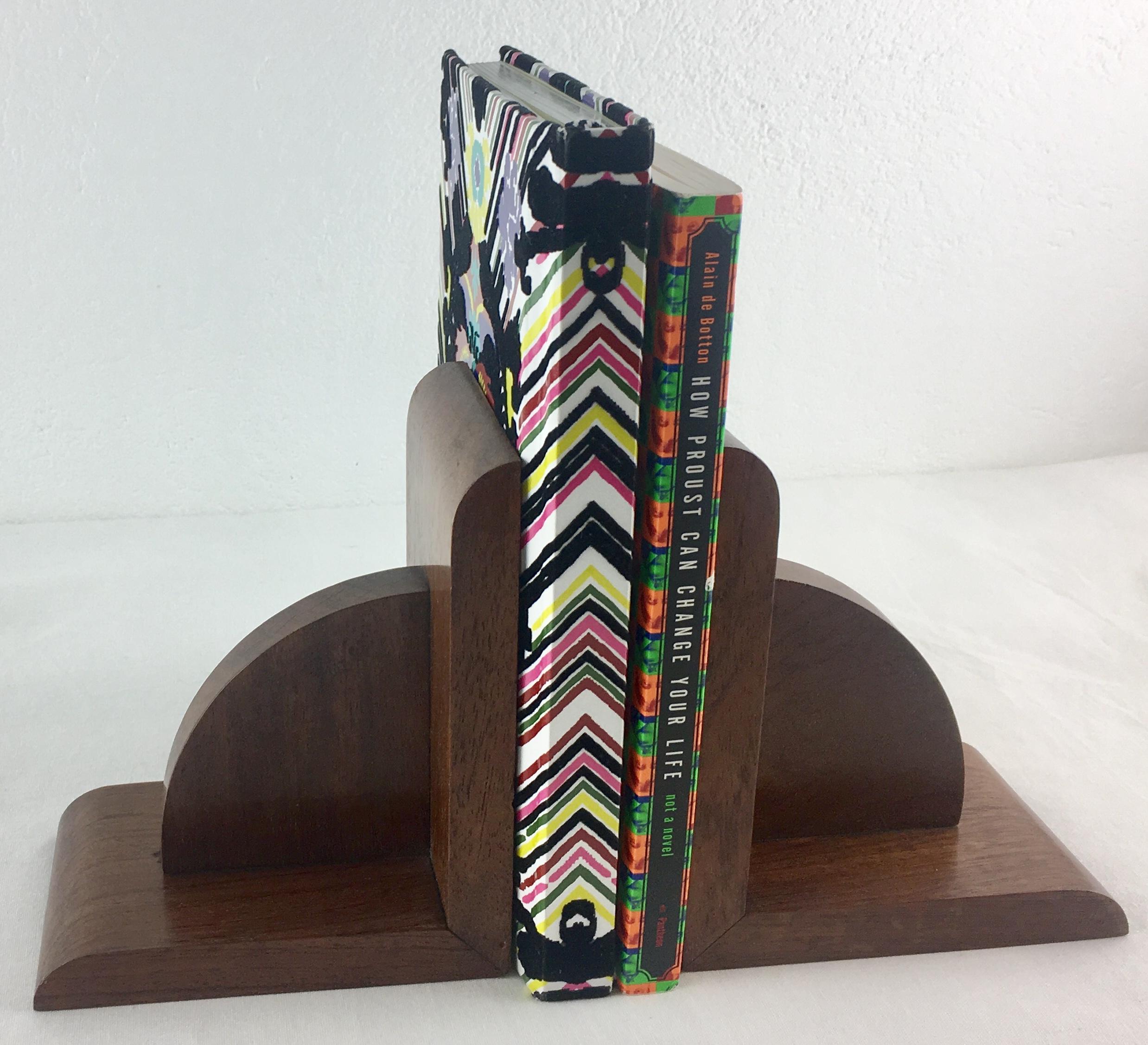 A nice quality pair of French Art Deco period bookends. 

These handcrafted bookends can be positioned either horizontally or vertically to displace your favorite books on a nightstand, mantel, dresser or shelf. Made with all natural walnut wood.