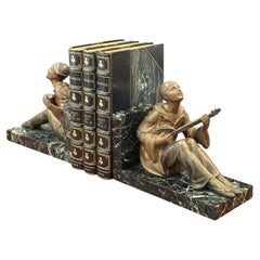 Pair of French Art Deco Figural Musician Bookends in Patinated Metal and Marble