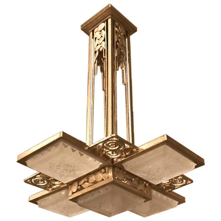 Pair of French Art Deco chandelier signed by Muller Frères Luneville. Having five beautiful clear frosted glass squares panels with geometric motif. Held by polished nickel wrought iron frame. The frame has incredible deco details throughout. The