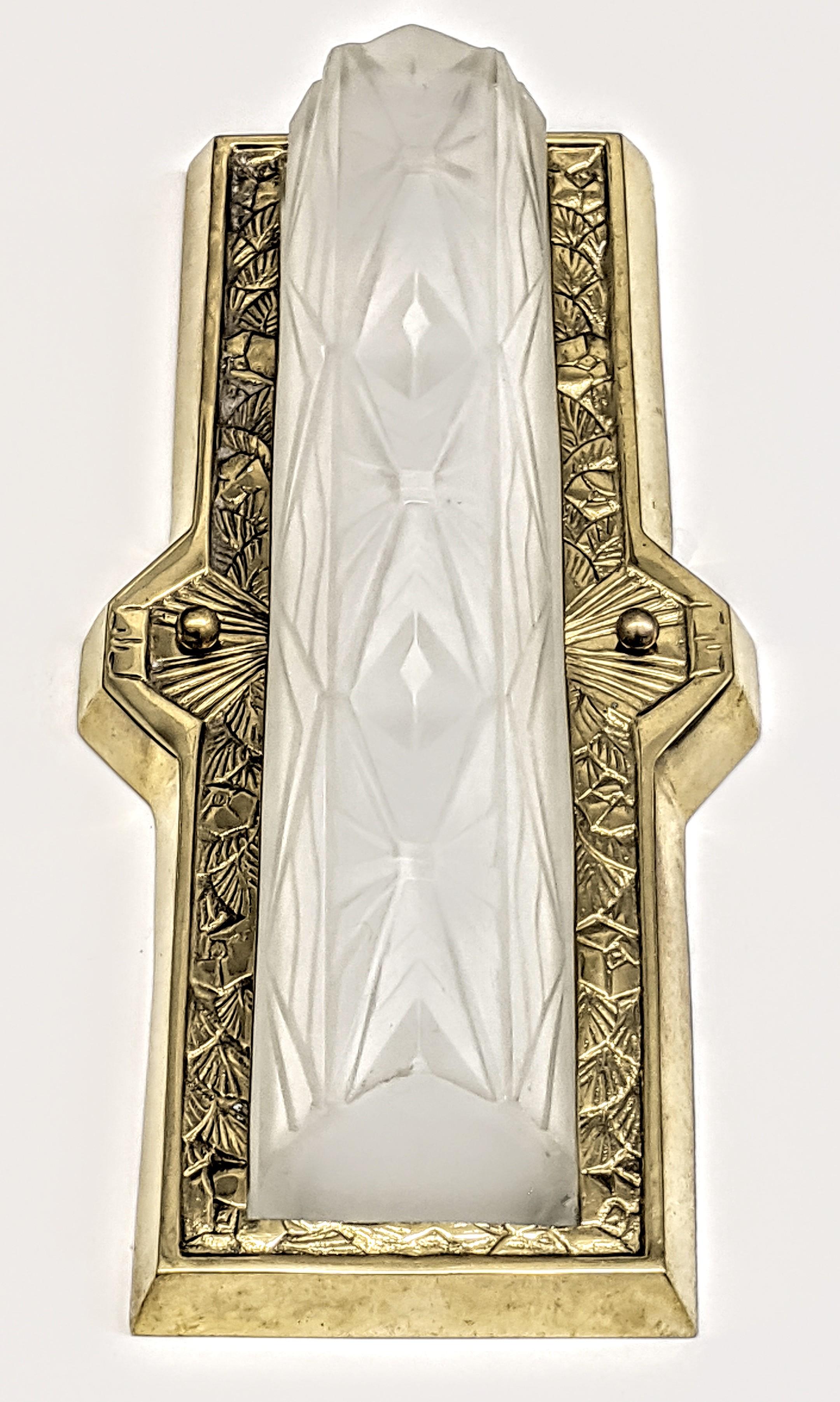 A pair of French Art Deco wall sconces created by the French artist 