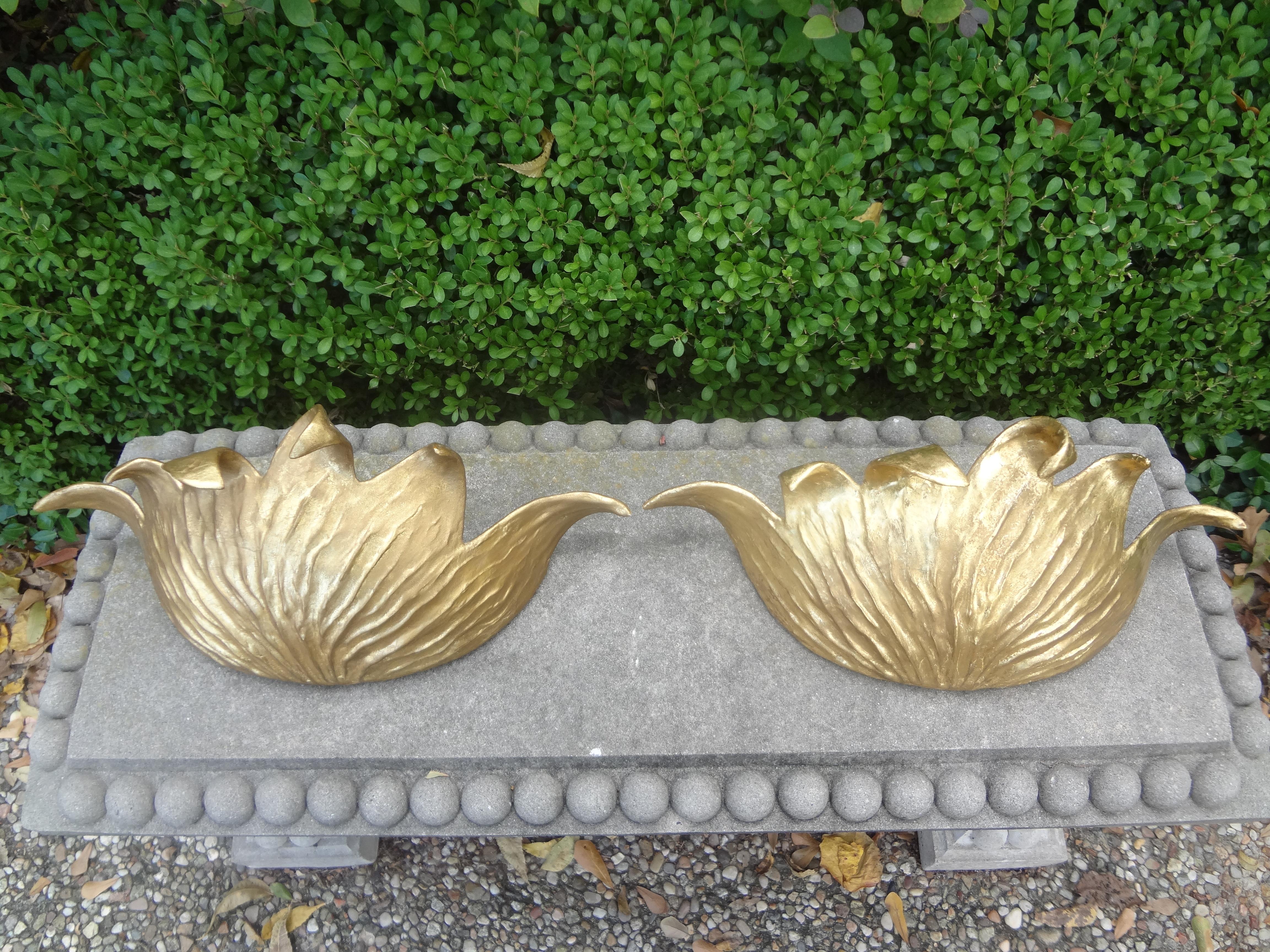 Pair of French Art Deco gilt plaster sconces. 
Chic pair of French Art Deco gilt plaster/gilt ceramic sconces signed Lejardy 1929.
This beautiful pair of French Serge Roche style gilt sconces have been newly wired with new sockets for the U.S.