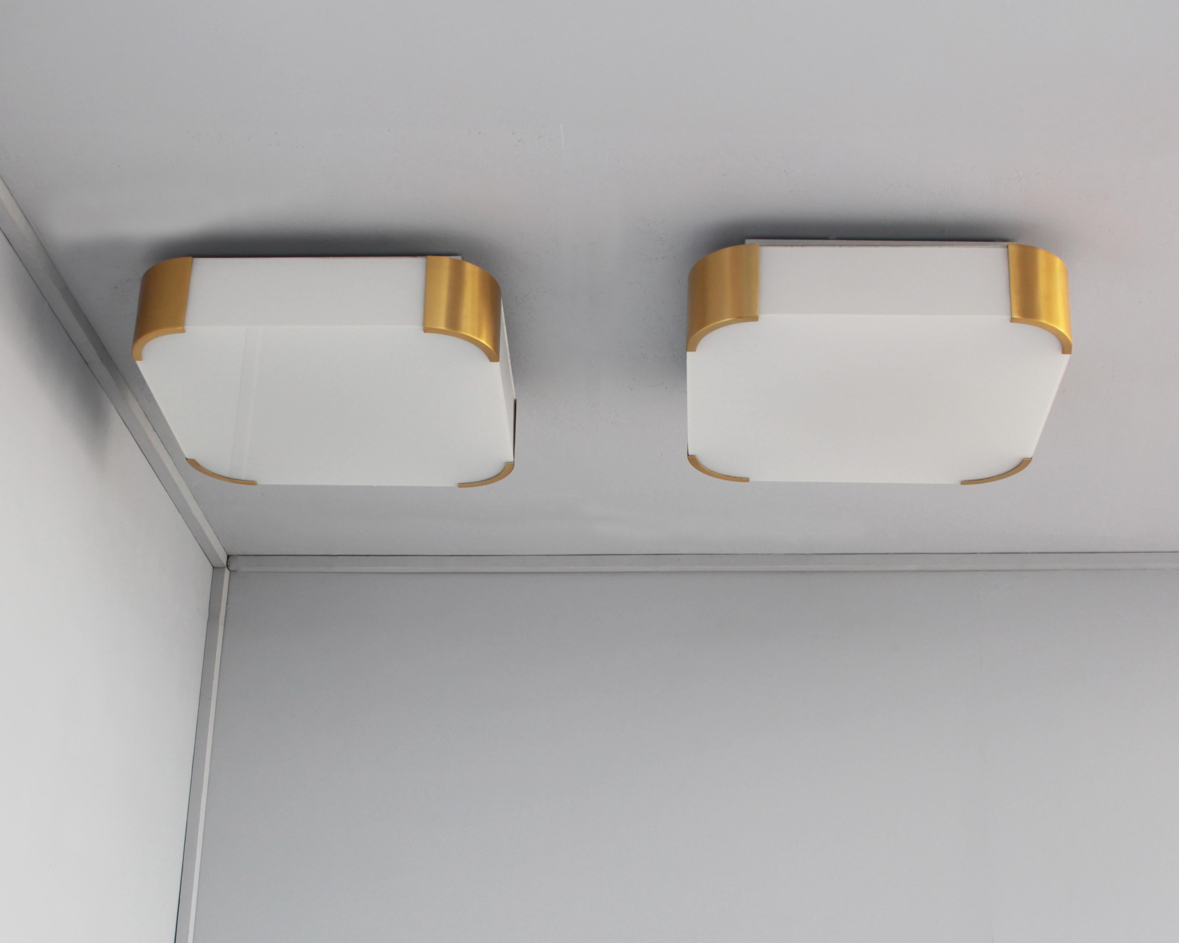 Atelier Jean Perzel - A pair of fine French Art Deco enameled glass and gilded bronze square flush mounts or sconces with rounded corners.
Signed
 
