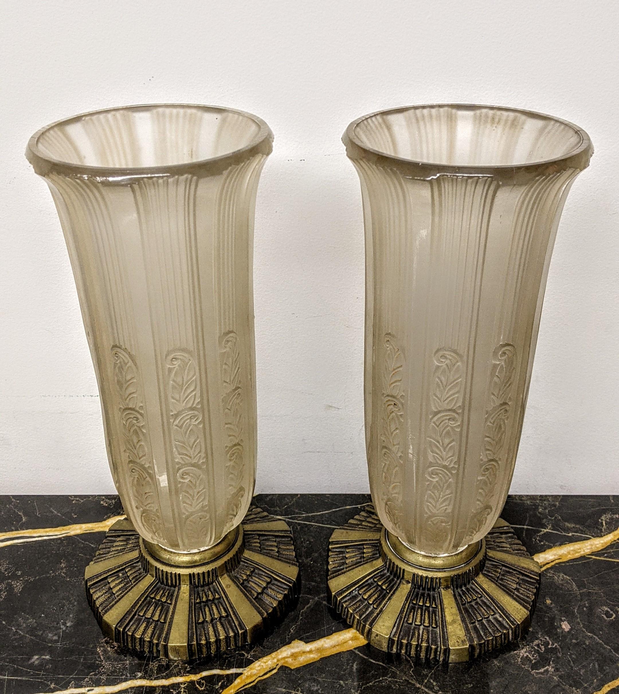 Stunning pair of French Art Deco vases with flower motif throughout with decorative bronze base by Hettier and Vincent. Can be turned into a pair of table lamps with an additional charge. We are the rare source that specializes exclusively in French