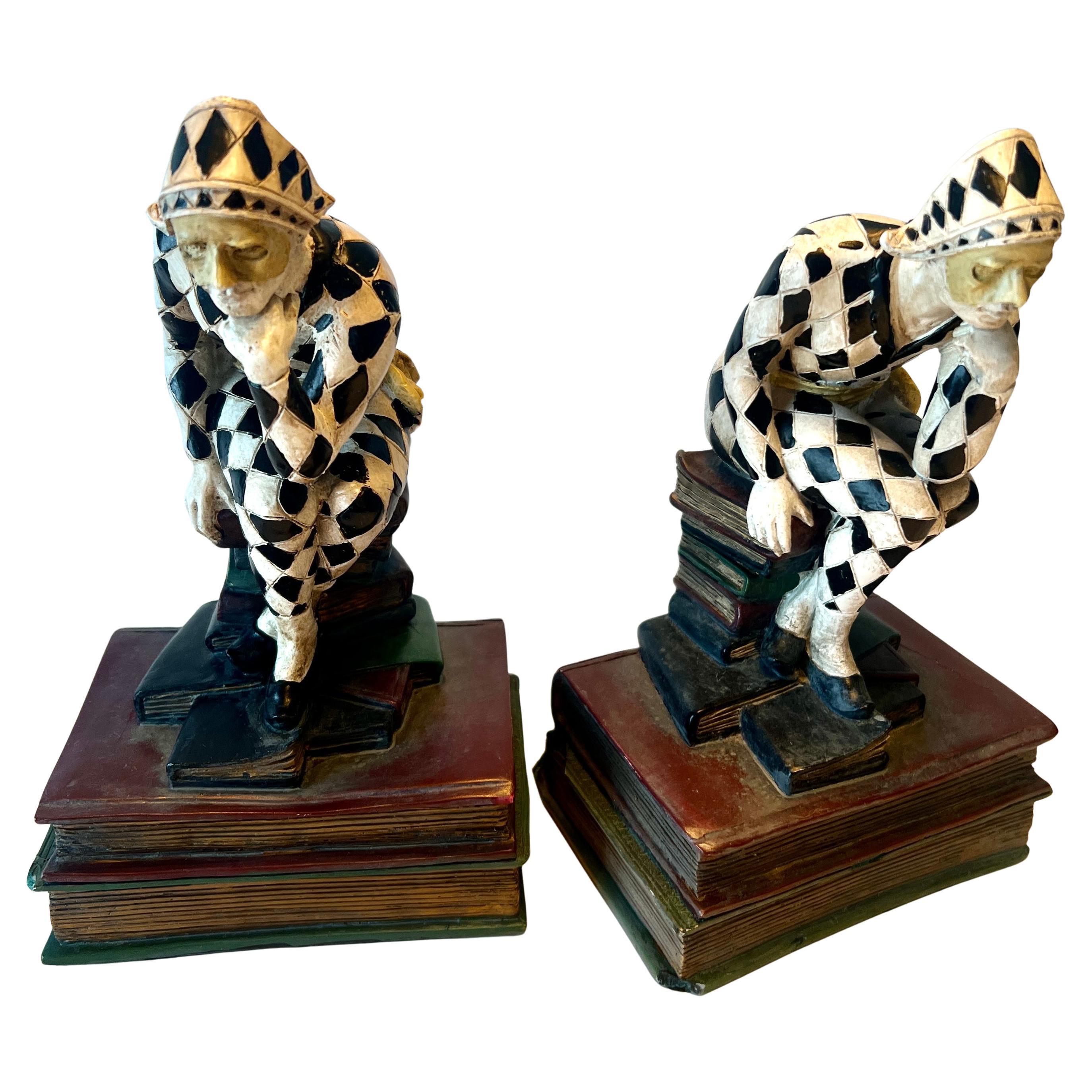 A wonderful pair of Harlequin bookends.  The pair are very detailed, with masks and hand painted.  Acquired in France

A compliment to any book shelf, desktop, work station and especially creative in a Childs room.  

The pair has a wonderful