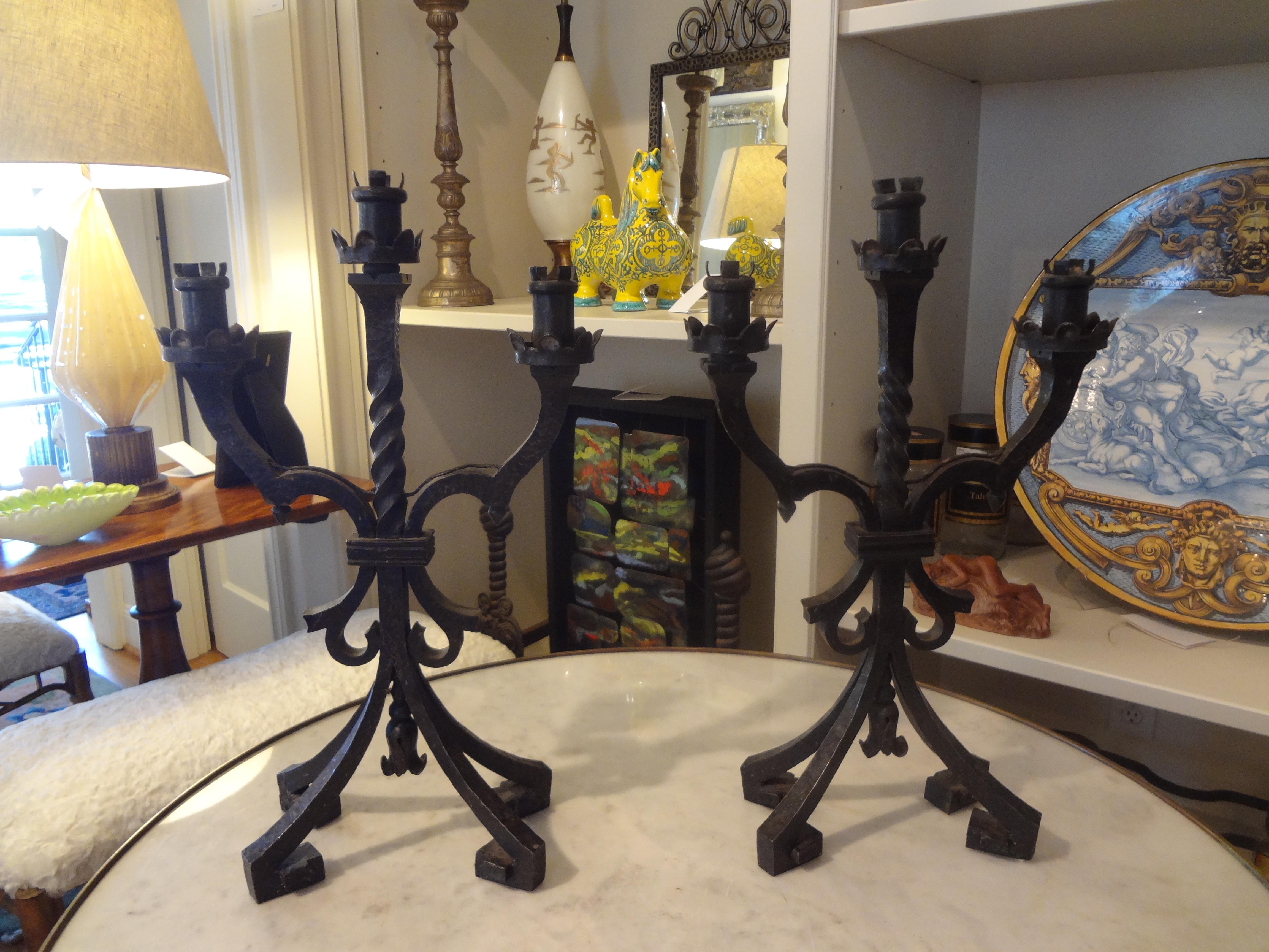 Pair of French Art Deco Iron Candleholders or Lamps Attributed to Charles Piguet.
Stunning pair of French Art Deco hand forged wrought iron candleholders or lamps with Greek key feet. This pair of lamps is attributed to Charles Piguet, circa 1925.