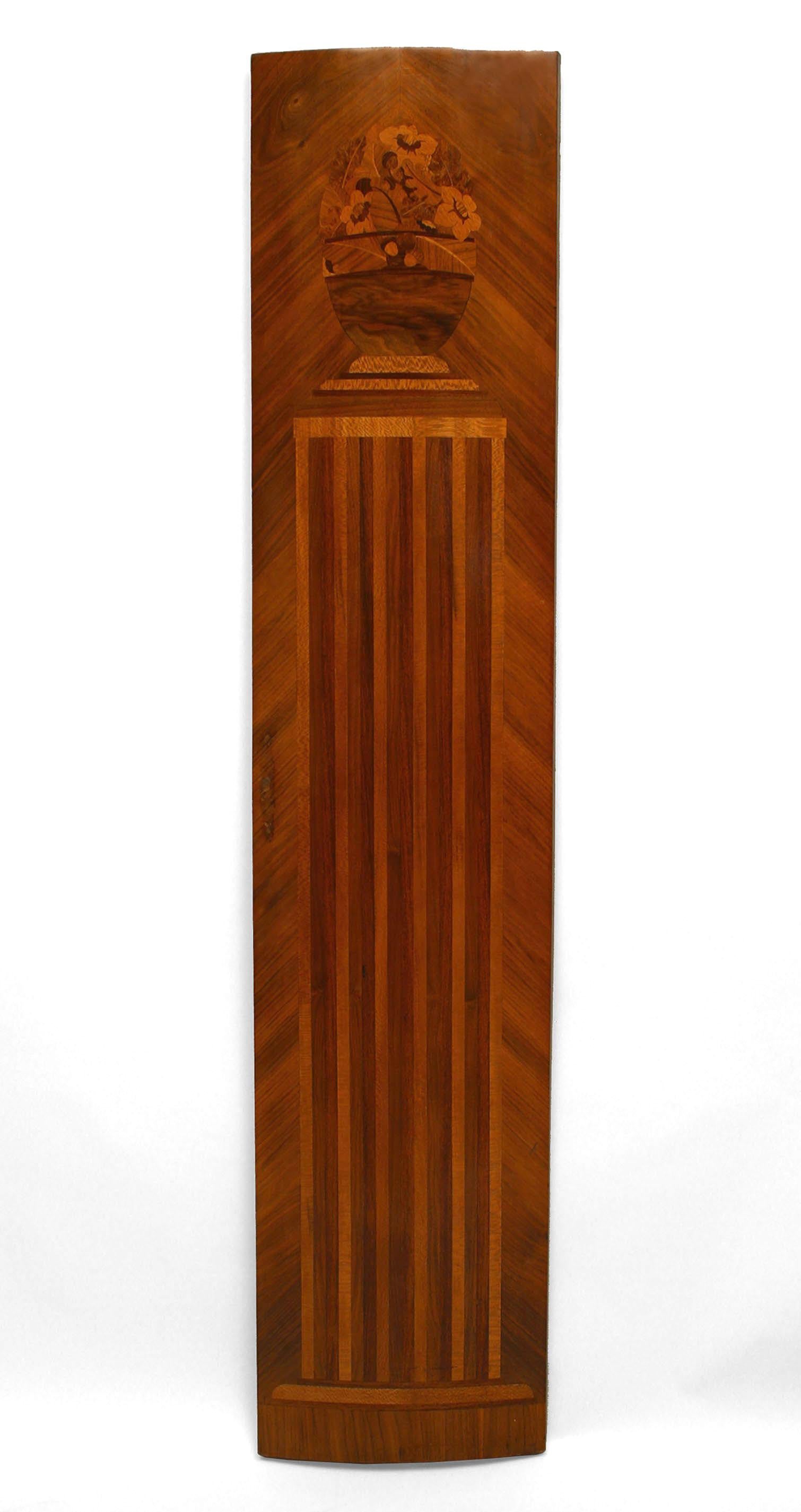 Pair of French Art Deco kingwood veneered pilaster panels with a slight convex shape and inlaid with various woods with a design of a fluted column supporting a vase with flowers (originally armoire doors).
 