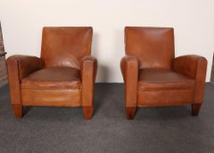 Pair of French Art Deco Leather Angled Back Club Chairs with Nailhead Decoration
