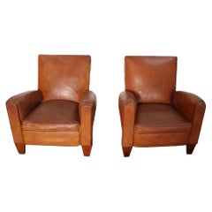 Pair of French Art Deco Leather Angled Back Club Chairs with Nailhead Decoration