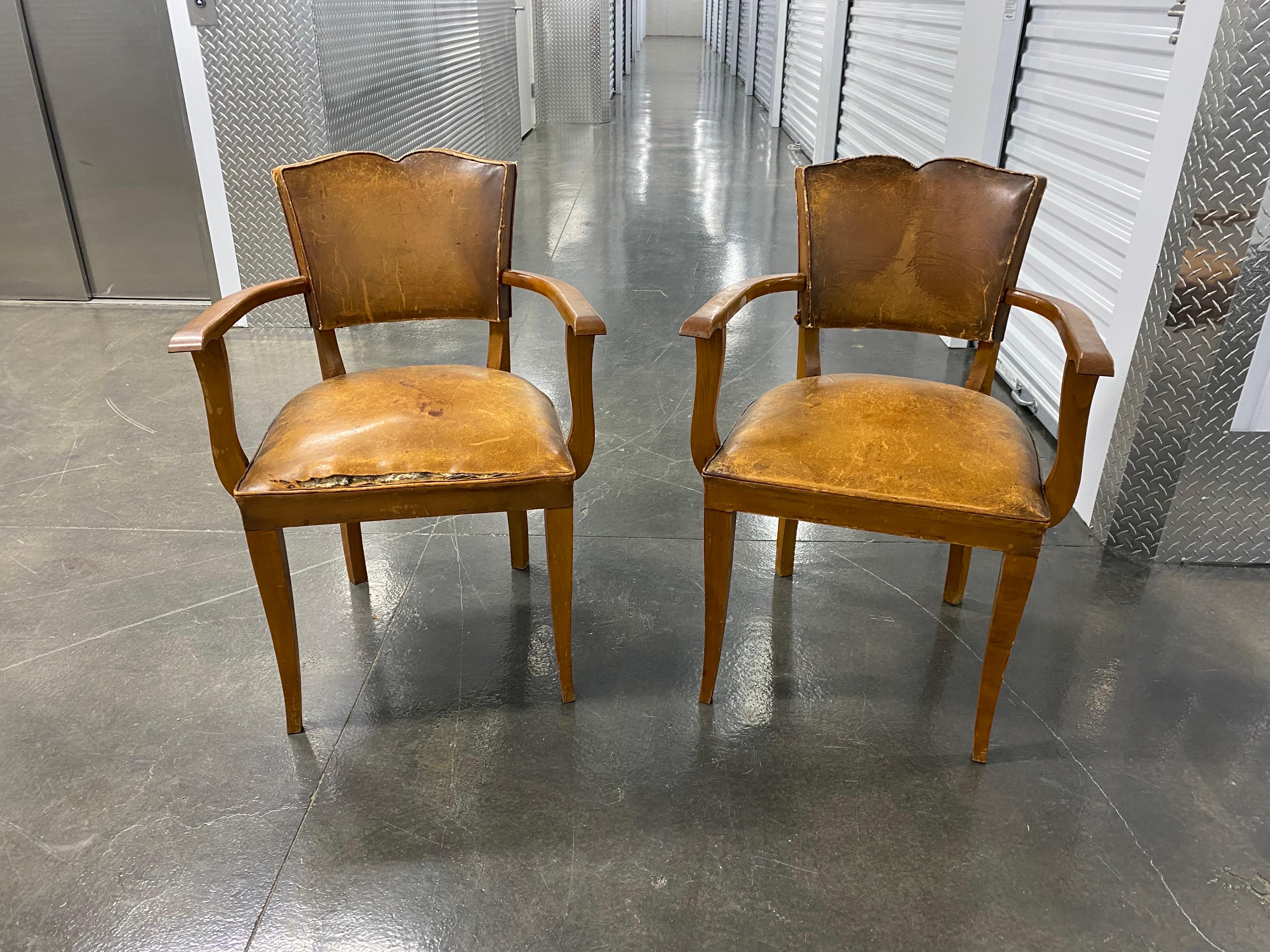 Pair of French Art Deco leather Moustache armchairs, 1930s
A handsome pair of taller armchairs. Classic Art Deco moustache lines on seat back, arms have a slight clean lined curve and, also echoed in the tapering legs. The leather has a wonderful