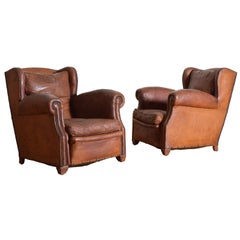Pair of French Art Deco Leather Upholstered Club Chairs, 20th Century Pair of French Art Deco Leather Upholstered Club Chairs, 20th Century