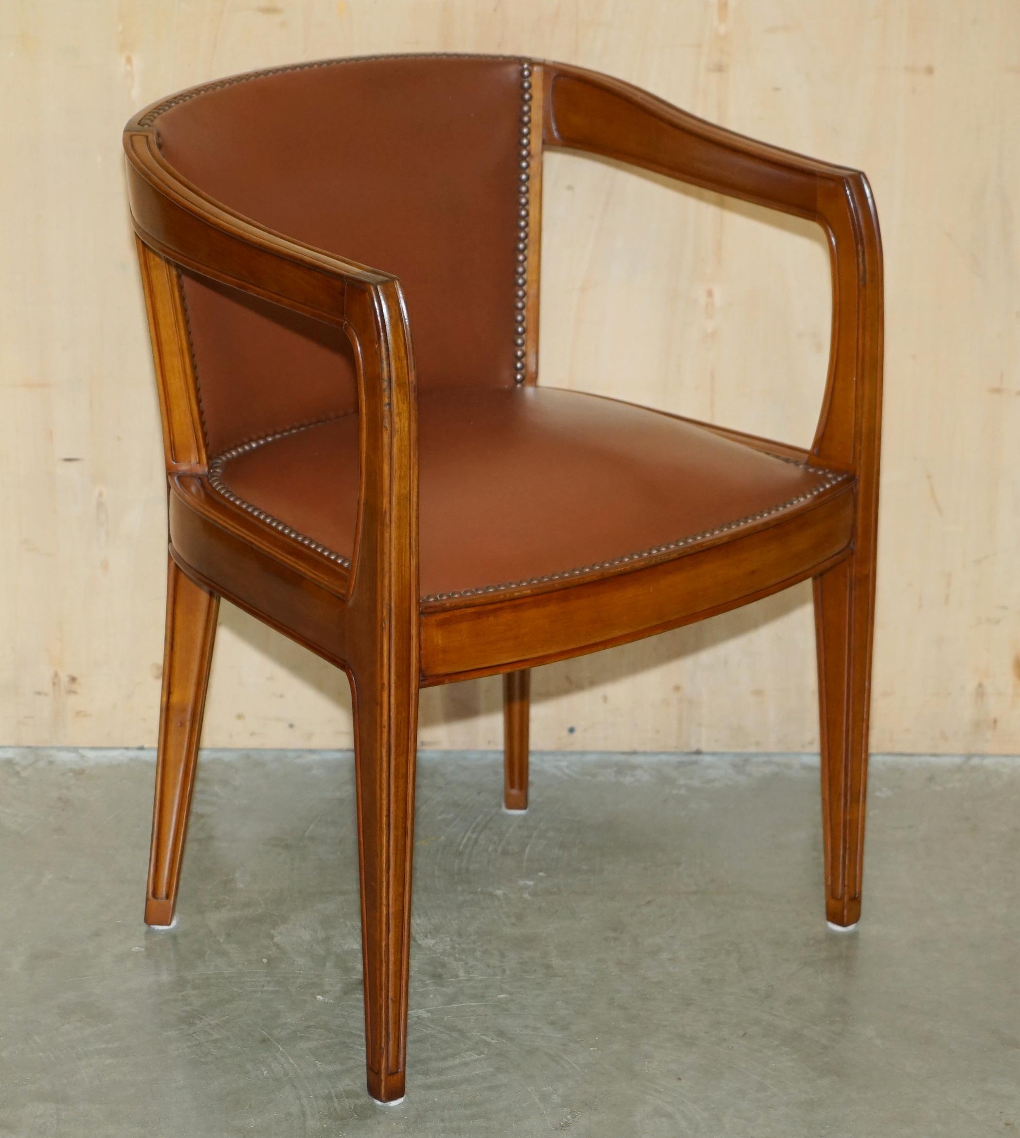 Royal House Antiques

Royal House Antiques is delighted to offer for sale this lovely pair of hand made in Paris France, Leon Jallot, Art Nouveau brown leather barrel back tub armchairs which are part of a large Library suite 

Please note the