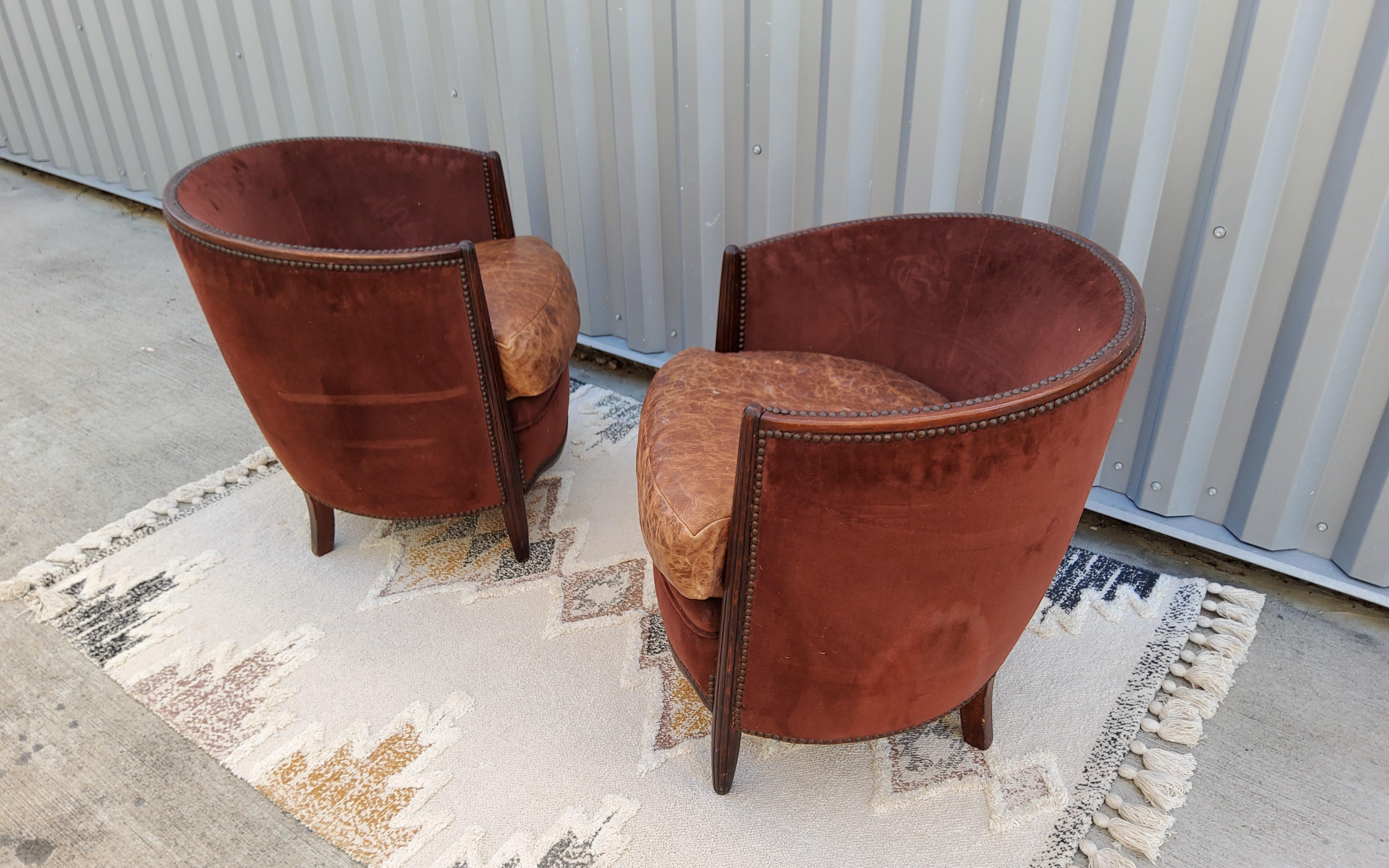 A timeless pair of French Art Deco Lounge Chairs in the style of Ruhlmann. Solid Oak frames with a reverse taper detail to the front of the arms/ legs. These are part of a salon suite set , I will be listing the sofa separately.

These are most