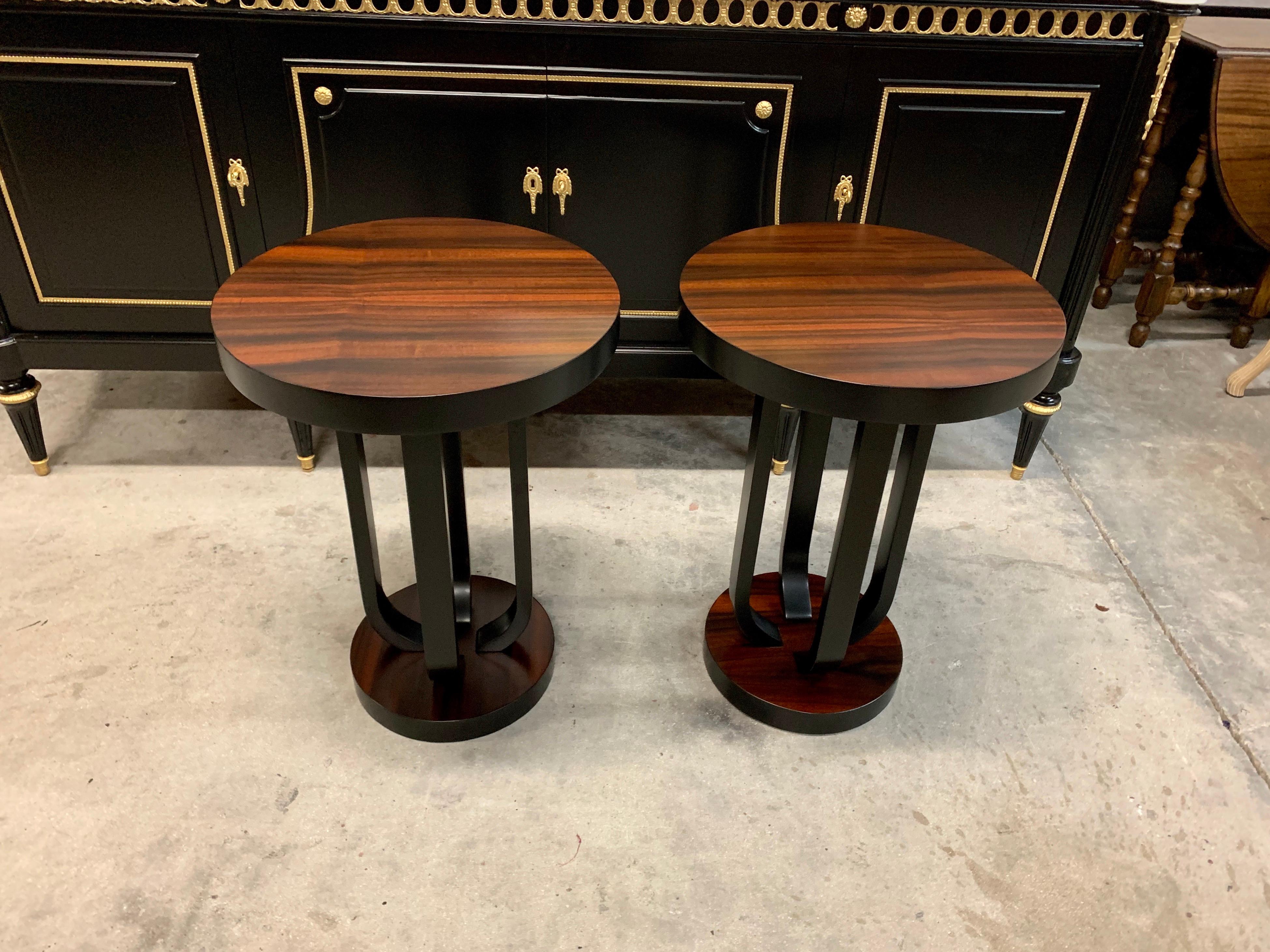 Pair of French Art Deco Macassar ebony side table or coffee table, circa 1940s. The table are with a French finish, that rest on makes it ideal next to a chair or for use as a bedside table. Size: 27.88 height x 19.88 diameter.