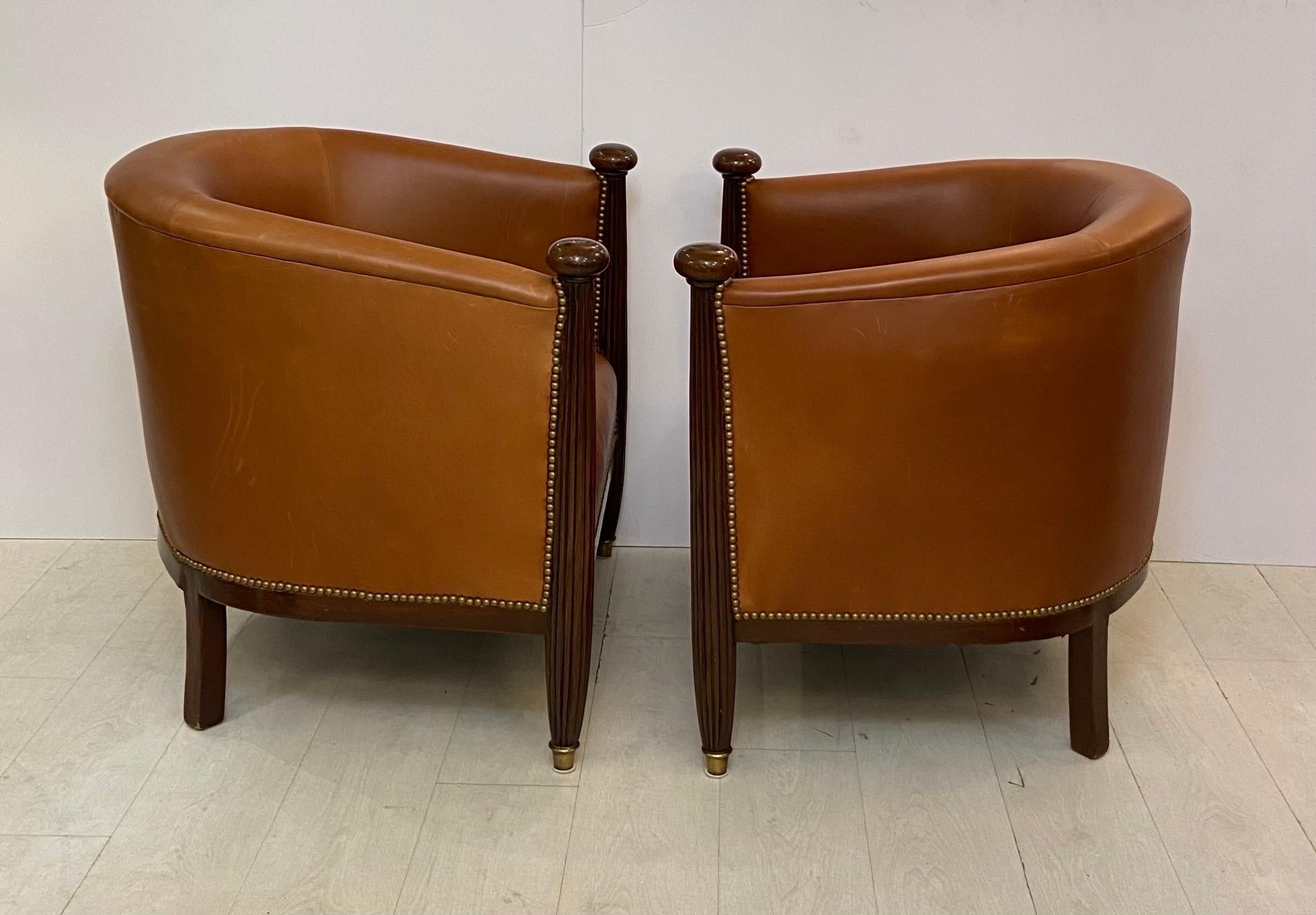 Hand-Crafted Pair of French Art Deco Mahogany Barrel Chairs Upholstered in Fine Leather 