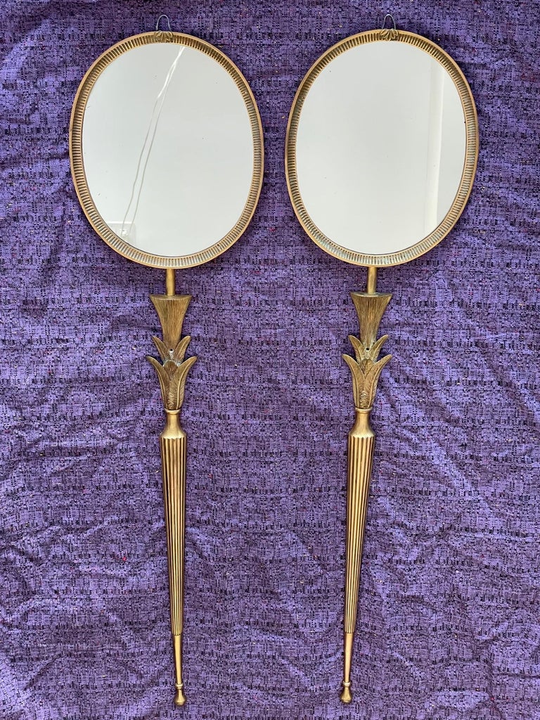 A pair of elegant French Art Deco wall mount mirrors or sconces. Beautiful bronze dore work-stylized leaf forms, highly detailed and heavy.