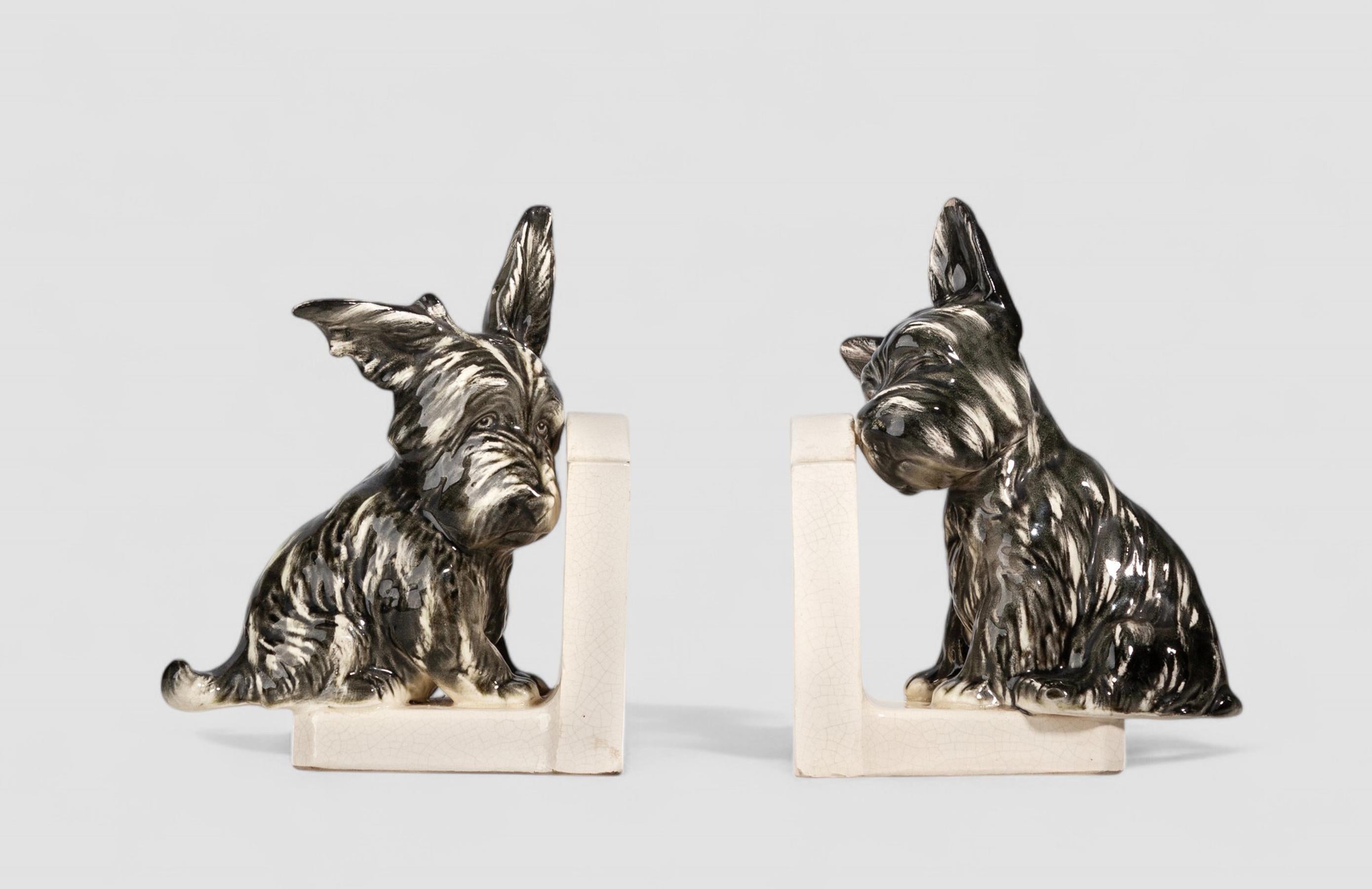 Pair of french Art Déco painted ceramic bookends shaped like Scotch Terrier dogs

By: unknown
Material: ceramic, enamel, paint
Technique: cast, pressed, painted, hand-painted, hand-crafted, enameled, glazed
Dimensions: 3.5 in x 6.5 in x 7.5 in
Date: