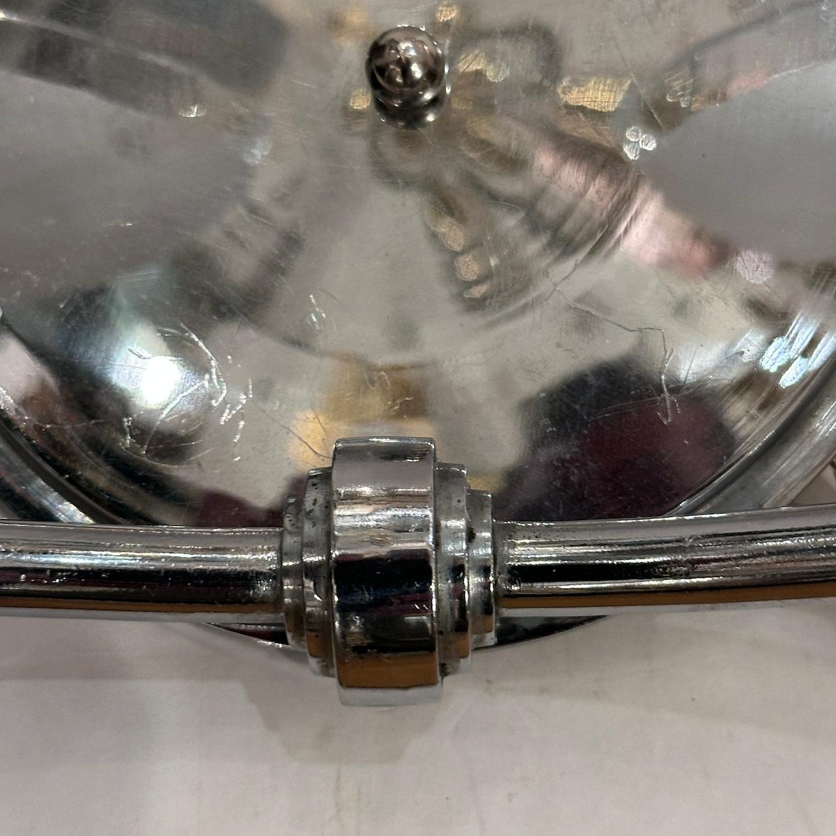Pair of circa 1940's French art deco nickel plated sconces with glass bobeches.

Measurements:
Height: 8