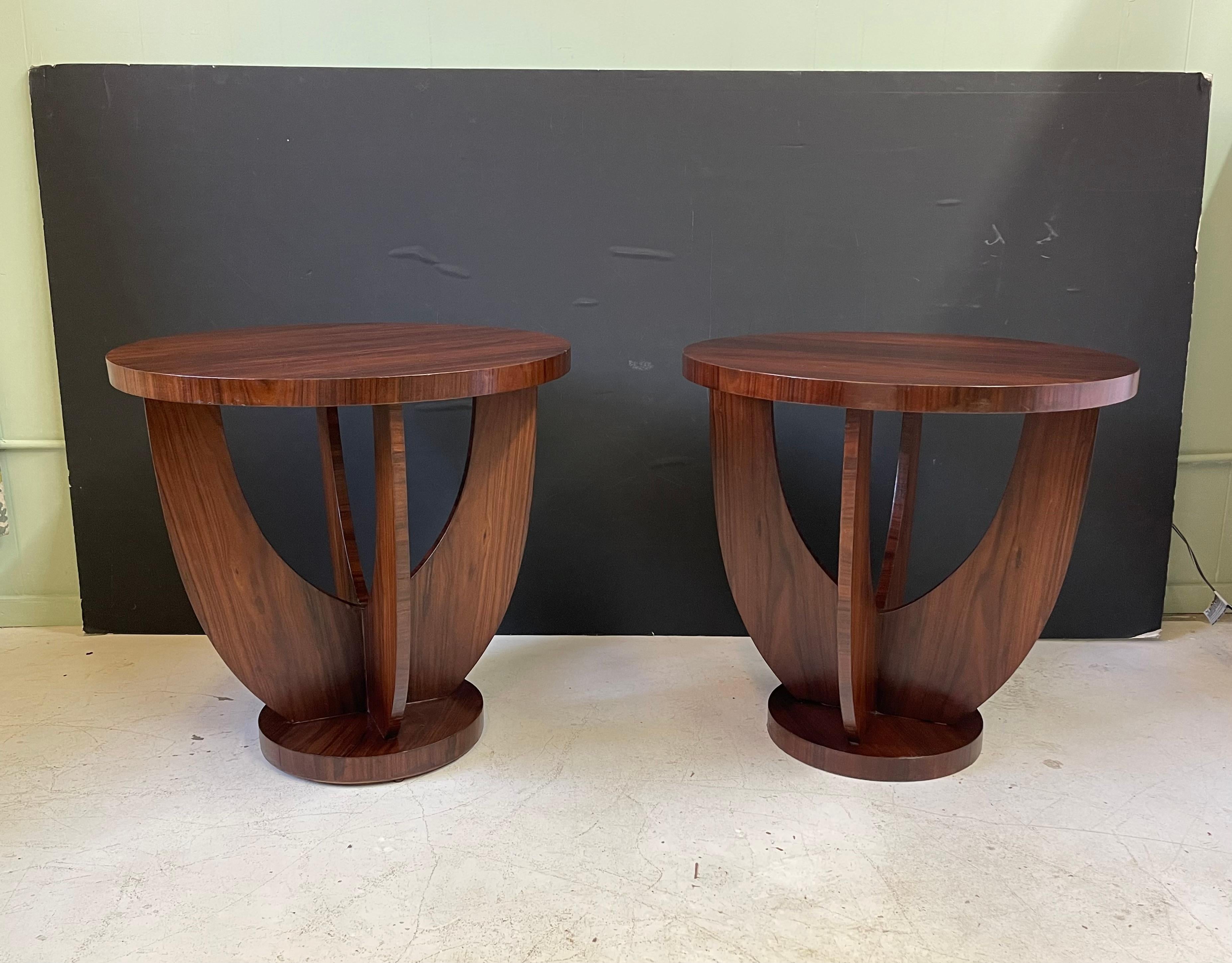 Pair of 20th century French side tables in the style of Art Deco and manner of designer Jules Leleu. They are elegantly made of Brazilian rosewood veneer.