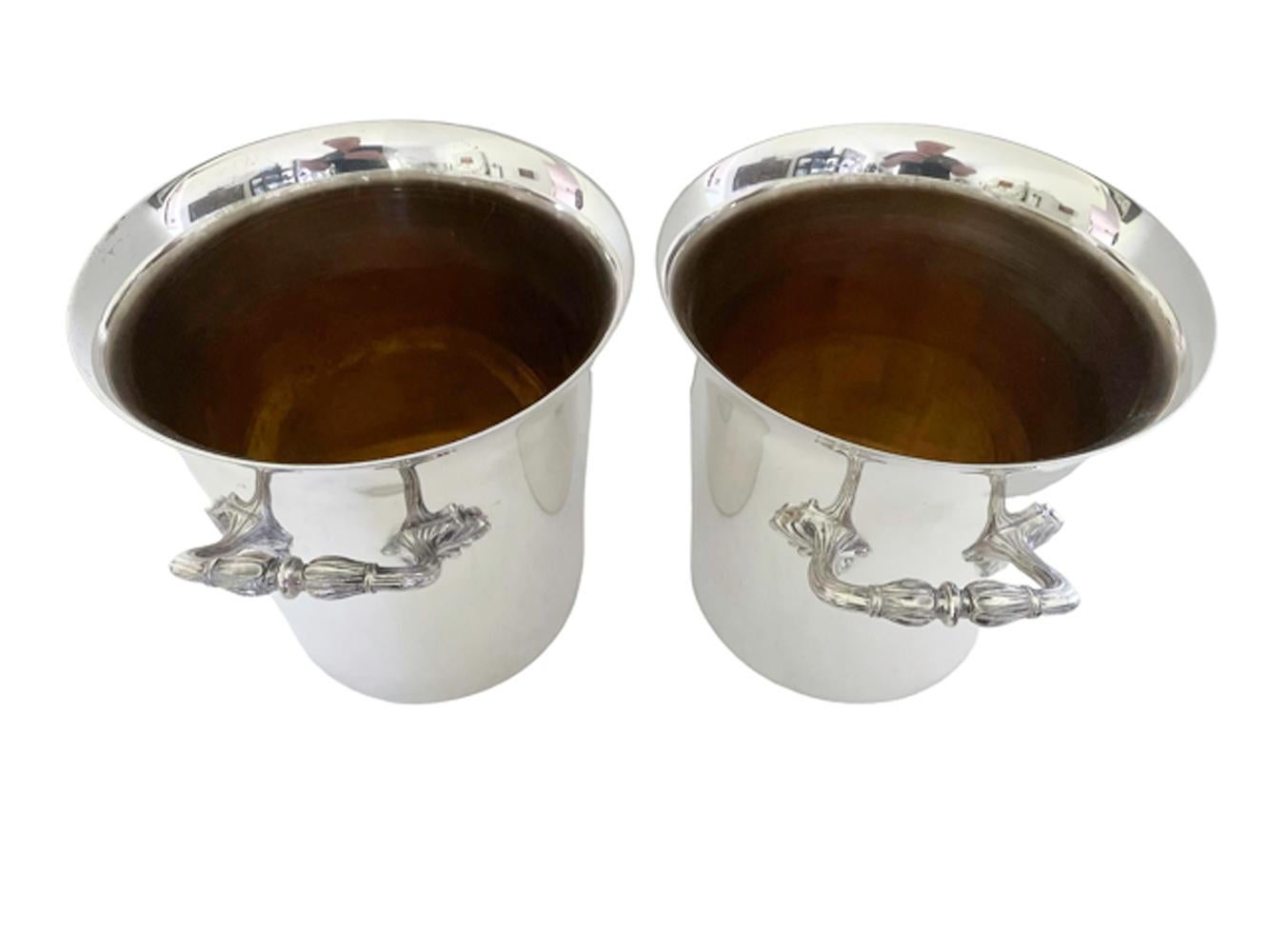 Pair of French Art Deco Champagne buckets / wine coolers of tapered form with flared rim and acanthus leaf molded handles. French makers mark on bottom (unidentified).