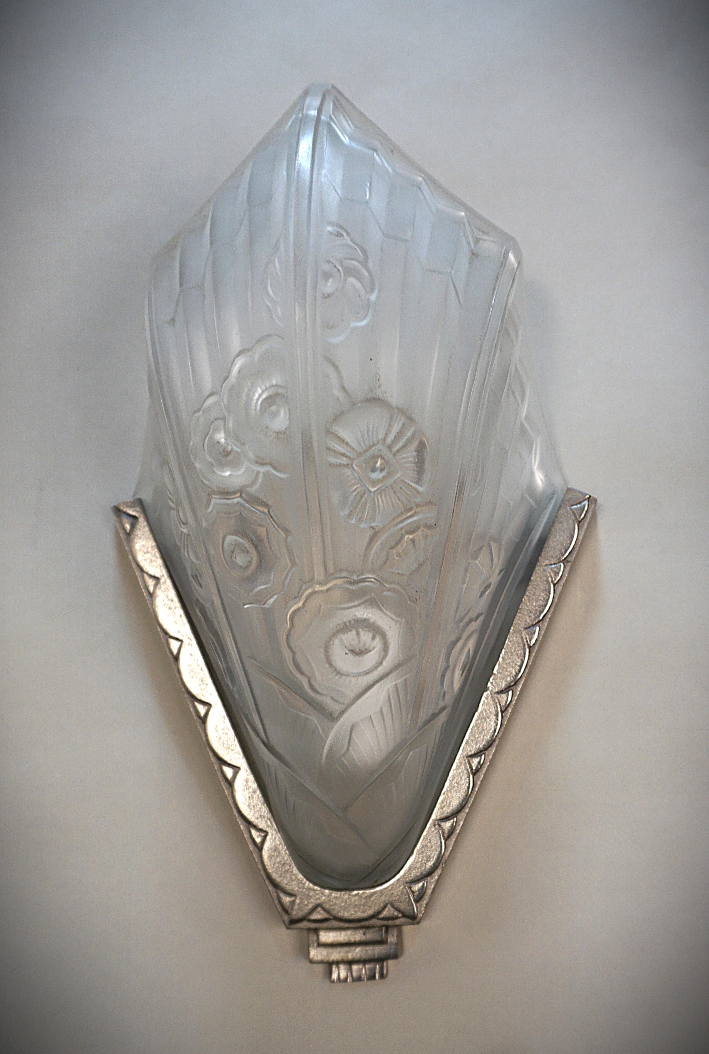 Pair of clear frost geometric design art deco wall sconces with satin nickel on bronze back plates.
Professionally rewired and ready for installation.