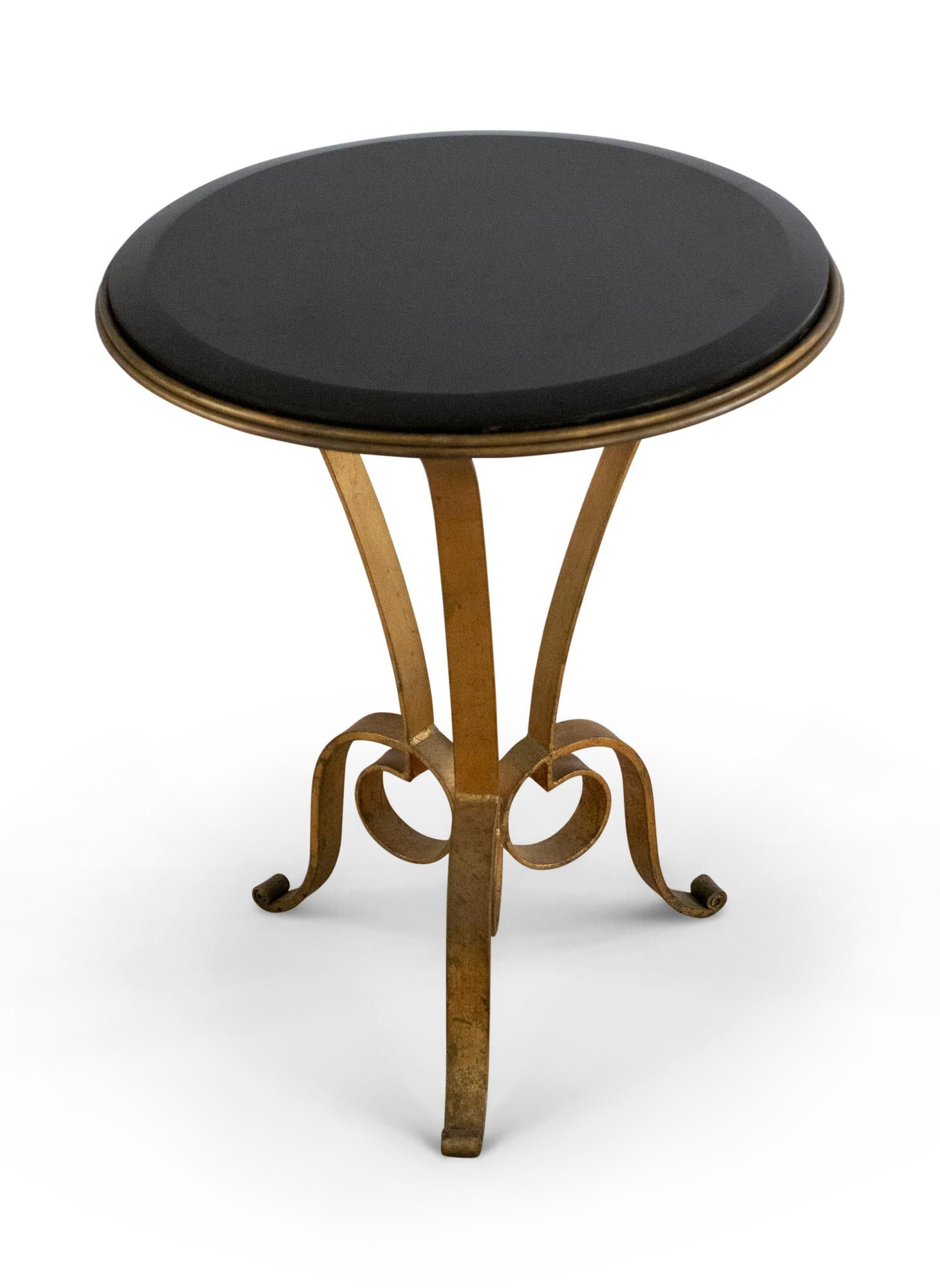 Pair of French Art Deco-style side / end table with curved gilt metal frames with three leg bases and circular black marble table tops.