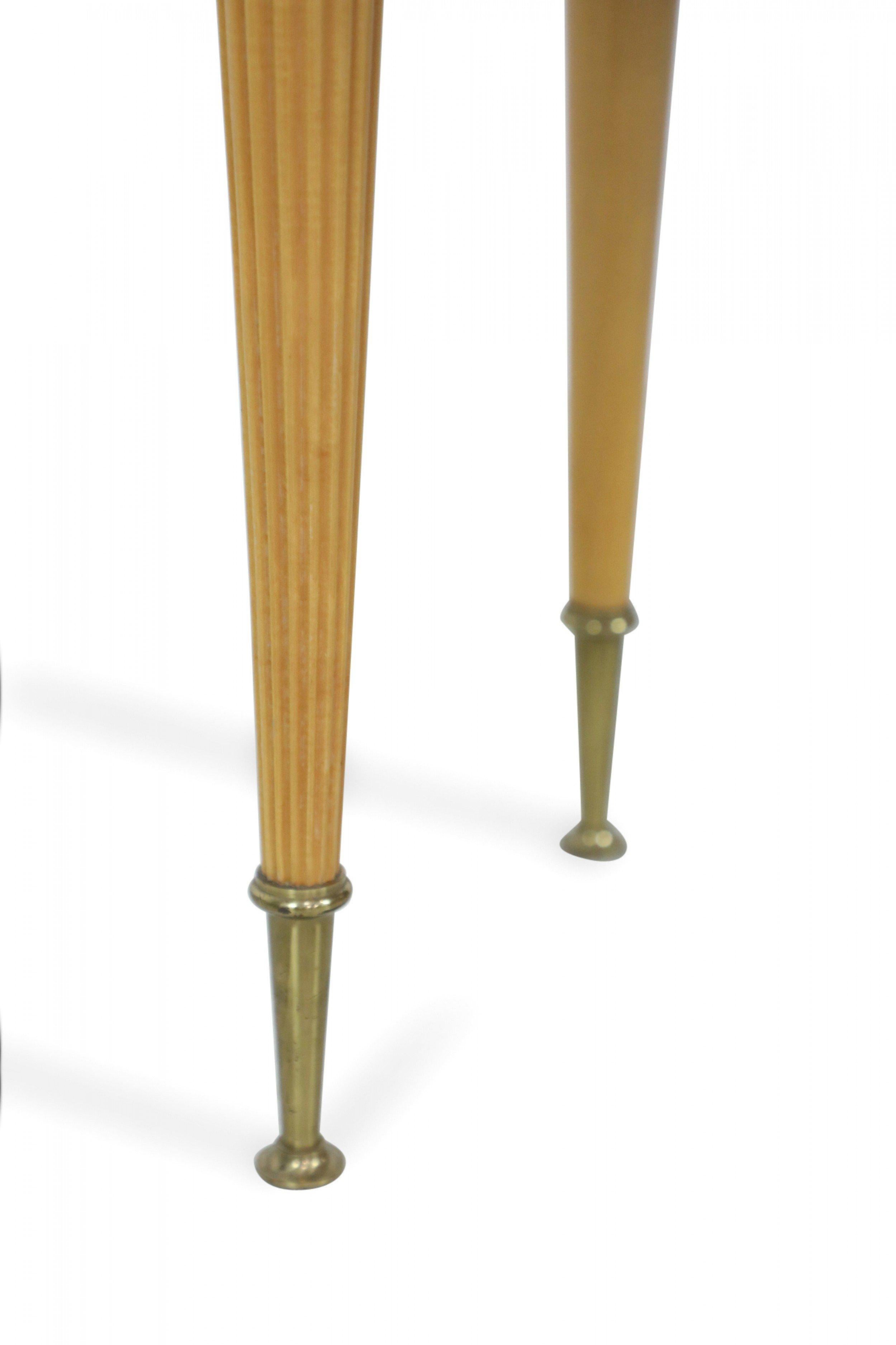 Pair of French mid-century (1940s) low sycamore end tables with a single drawer and two brass pulls with fluted front legs and tapered back legs, all ending in brass sabots. (priced as pair).
  