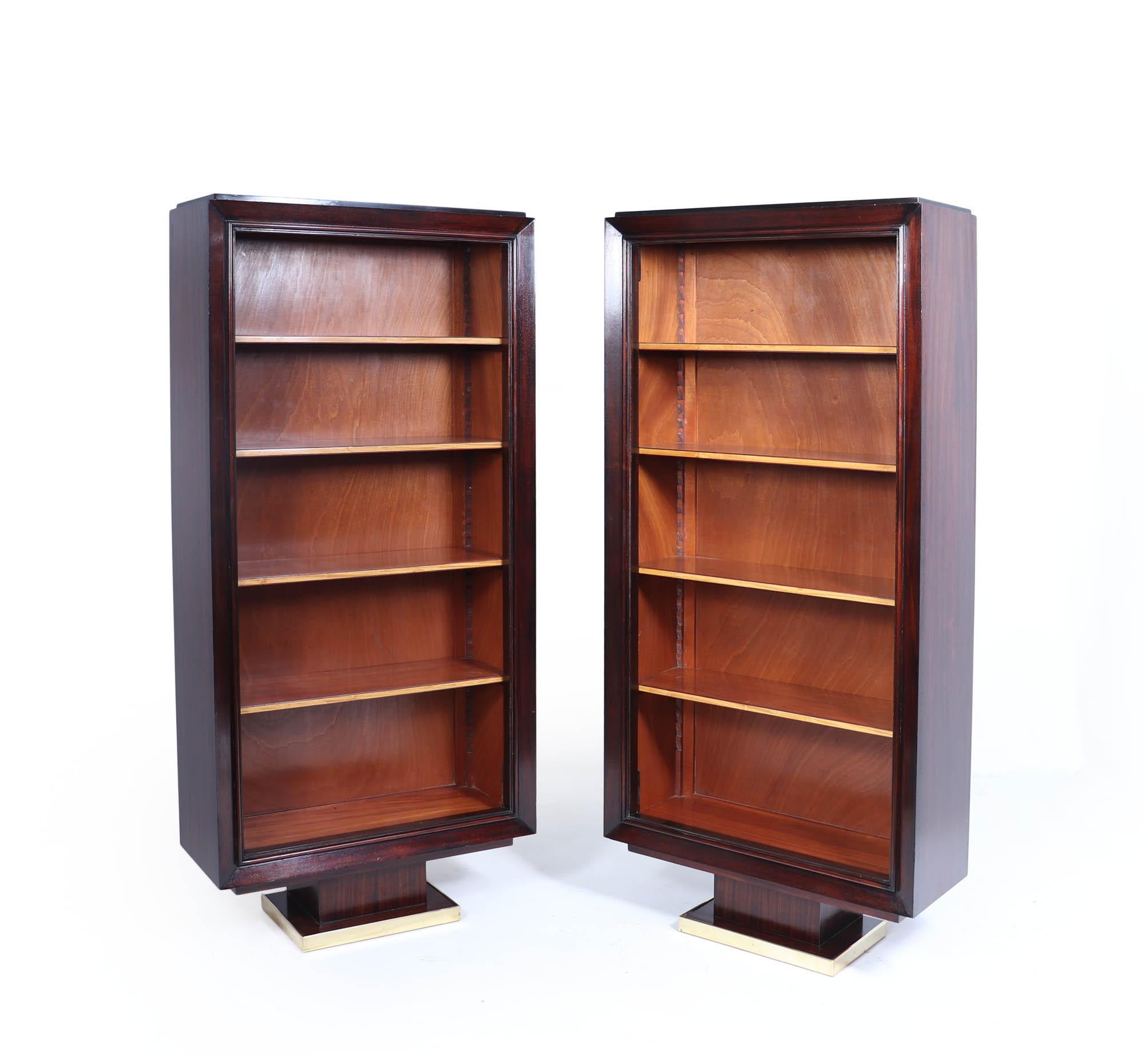 Art Deco Tall open Bookcases 
Discover the exquisite elegance of a pair of French Art Deco tall bookcases, c. 1925, attributed to the renowned designer Paul Dupre Lafon. Crafted from luxurious mahogany and rosewood, these stunning pieces serve not
