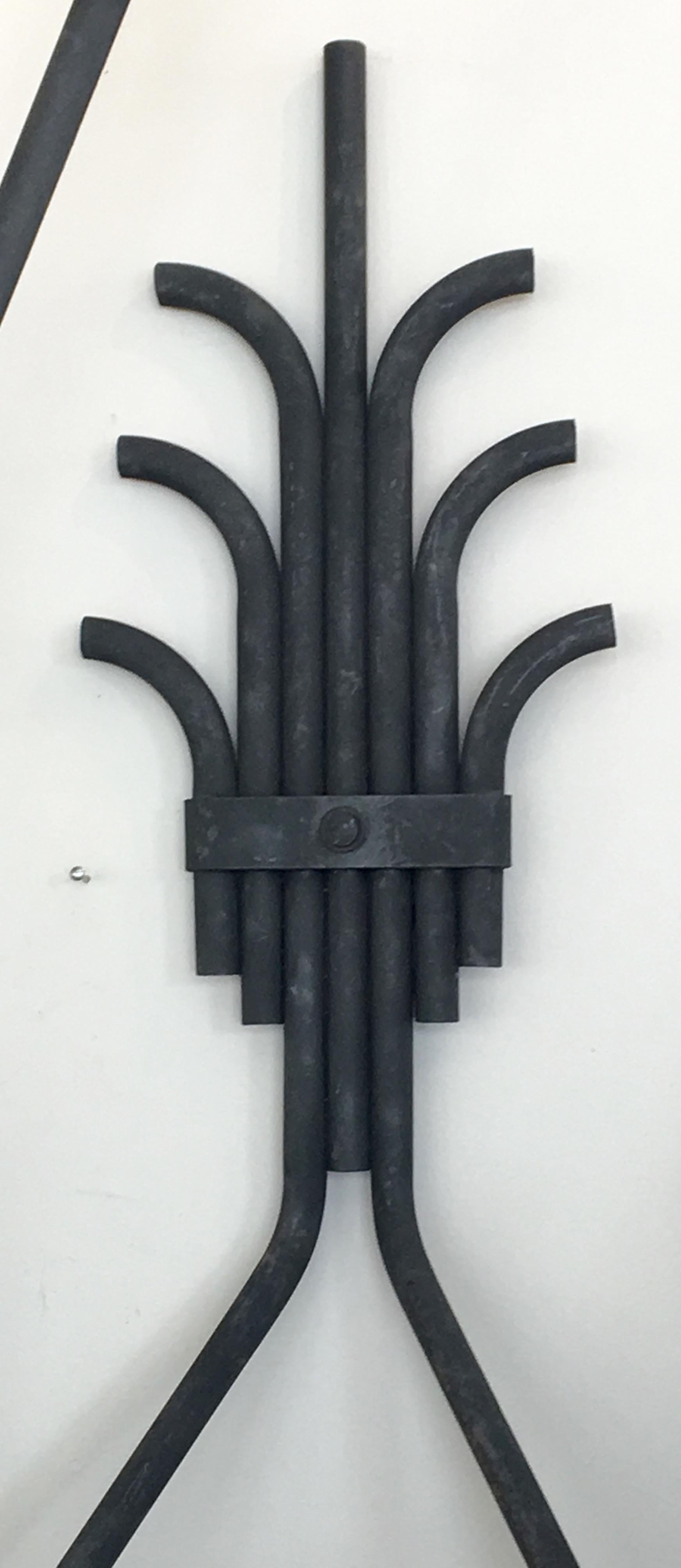 Simply dramatic, this pair of 1930s French Art Deco large scale tubular metal wall lights were originally gas lamps for a cinema. Can be fitted with candelabra shades, glass globes or exposed bulbs.
Custom finishes available. UL certification upon