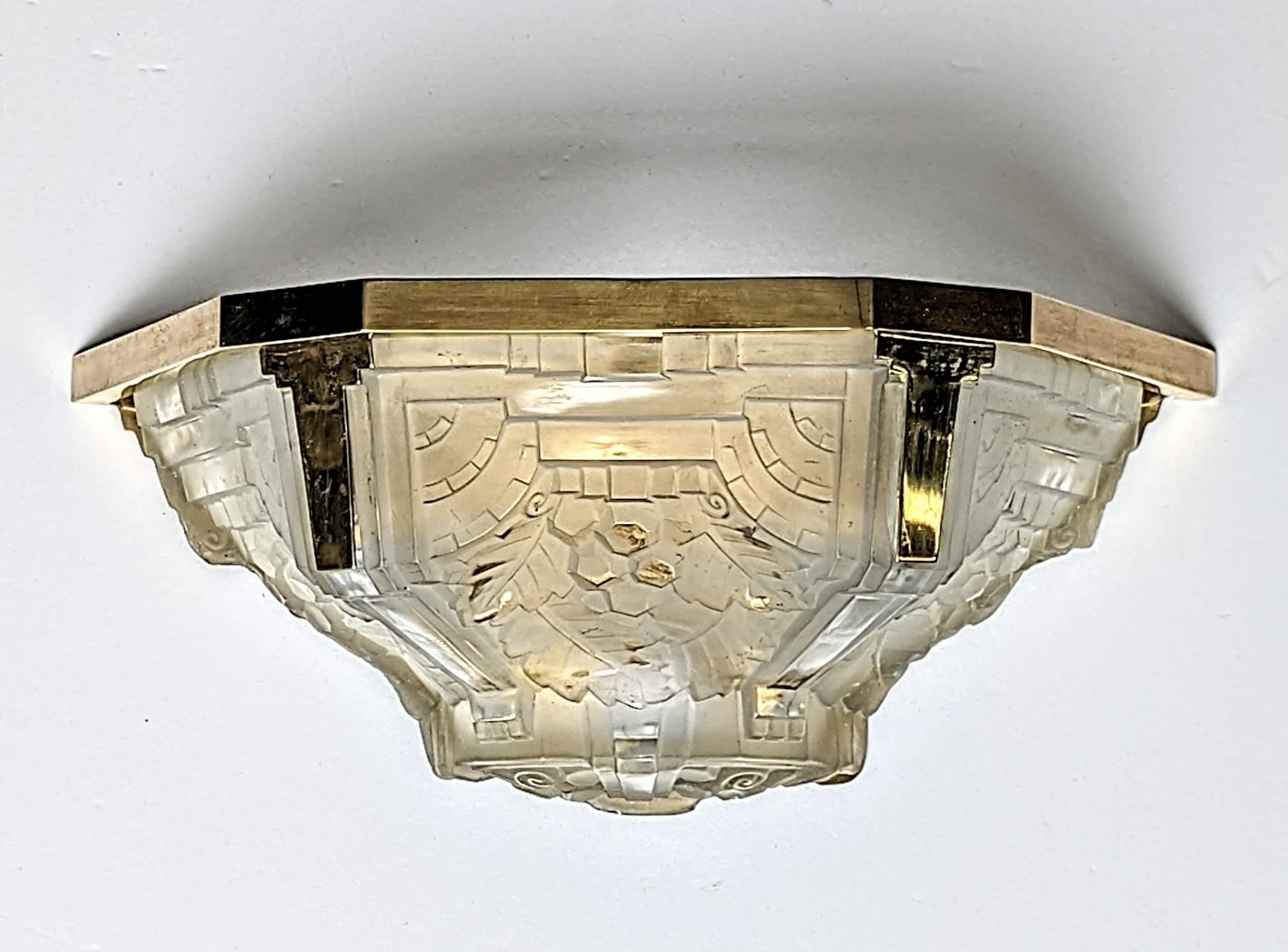 A pair of French Art Deco wall sconces by the French artist 