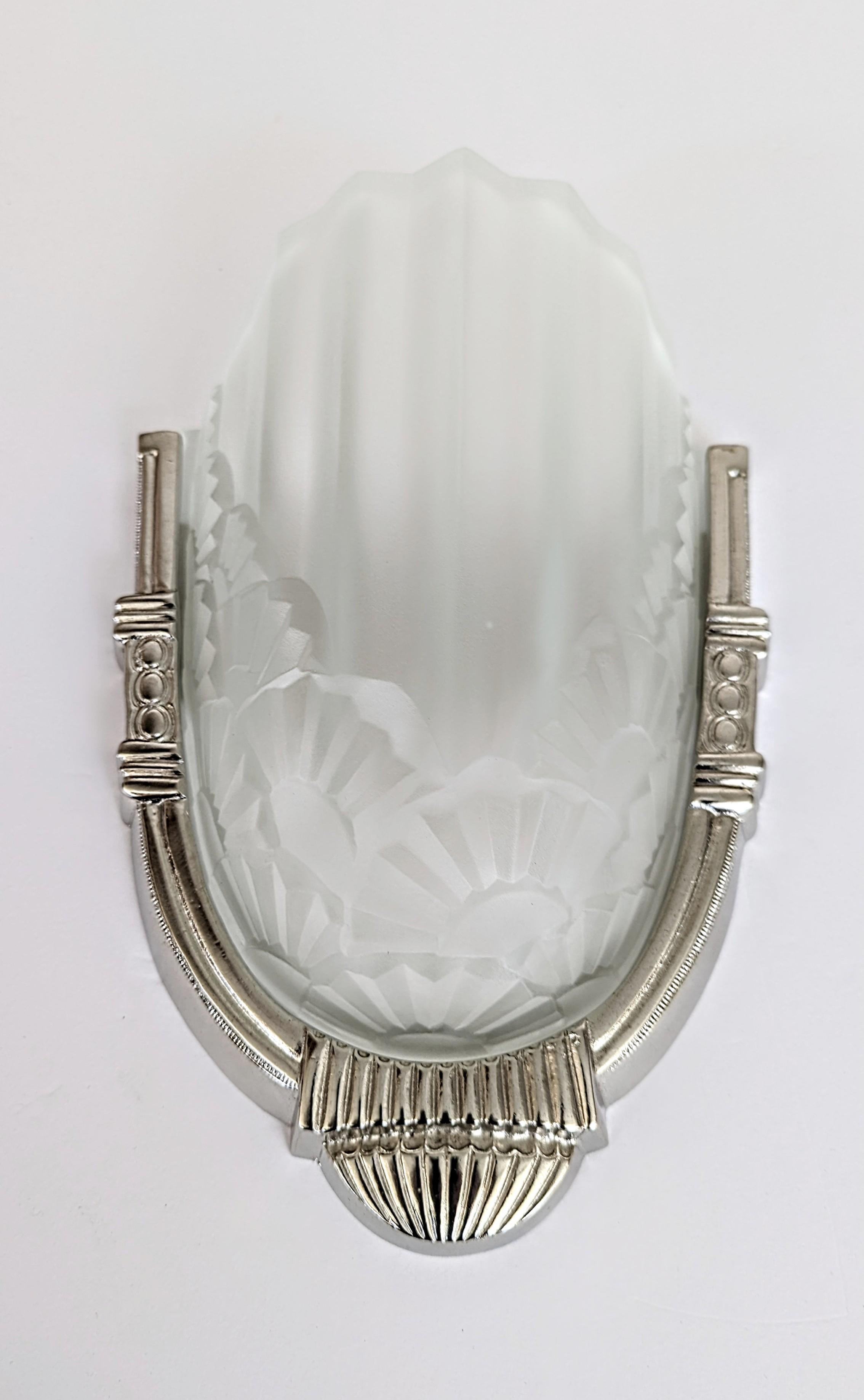 A pair of French Art Deco wall sconces by the French artist 