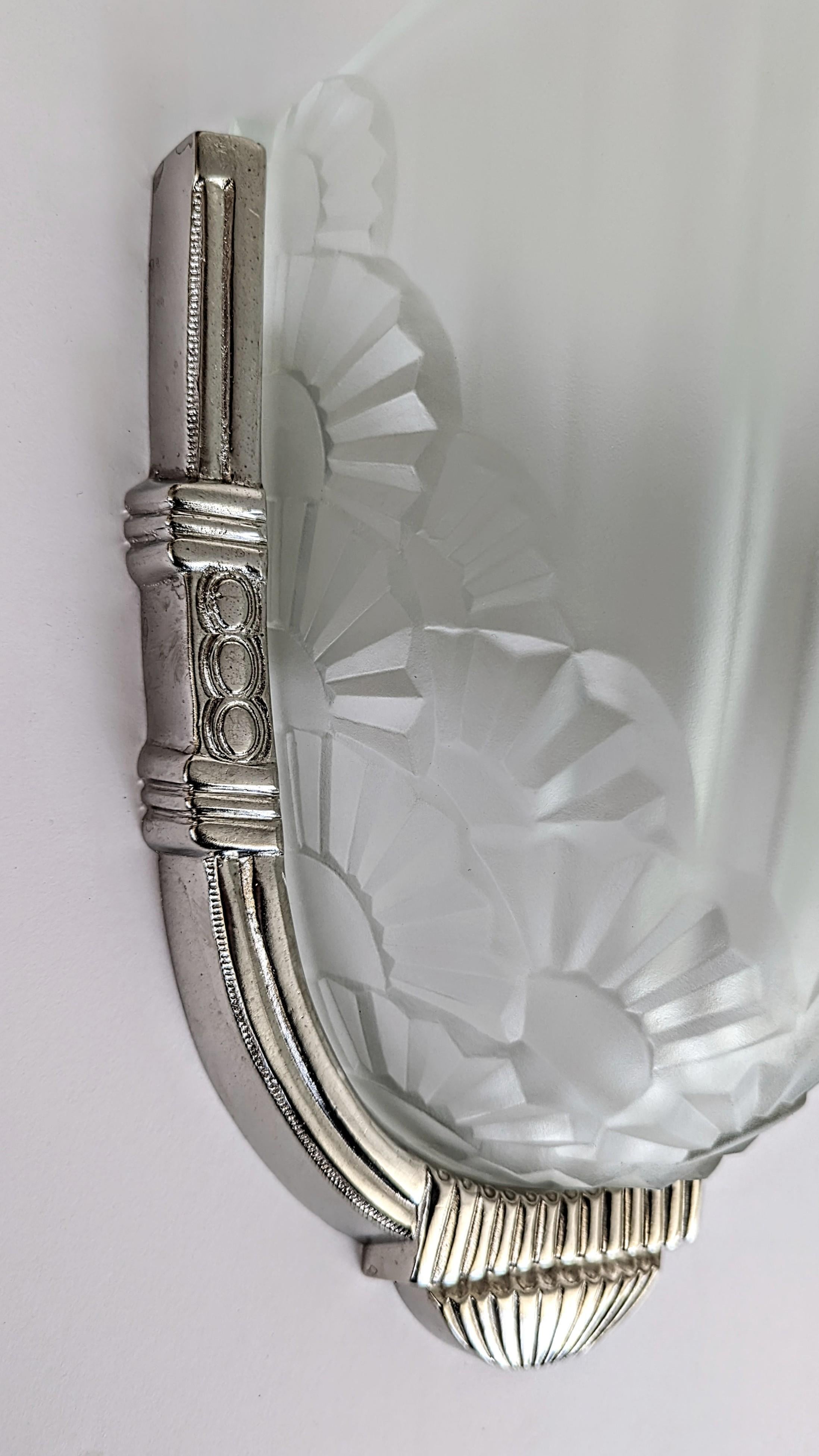 Cast Pair of French Art Deco Wall Sconces by Degue For Sale