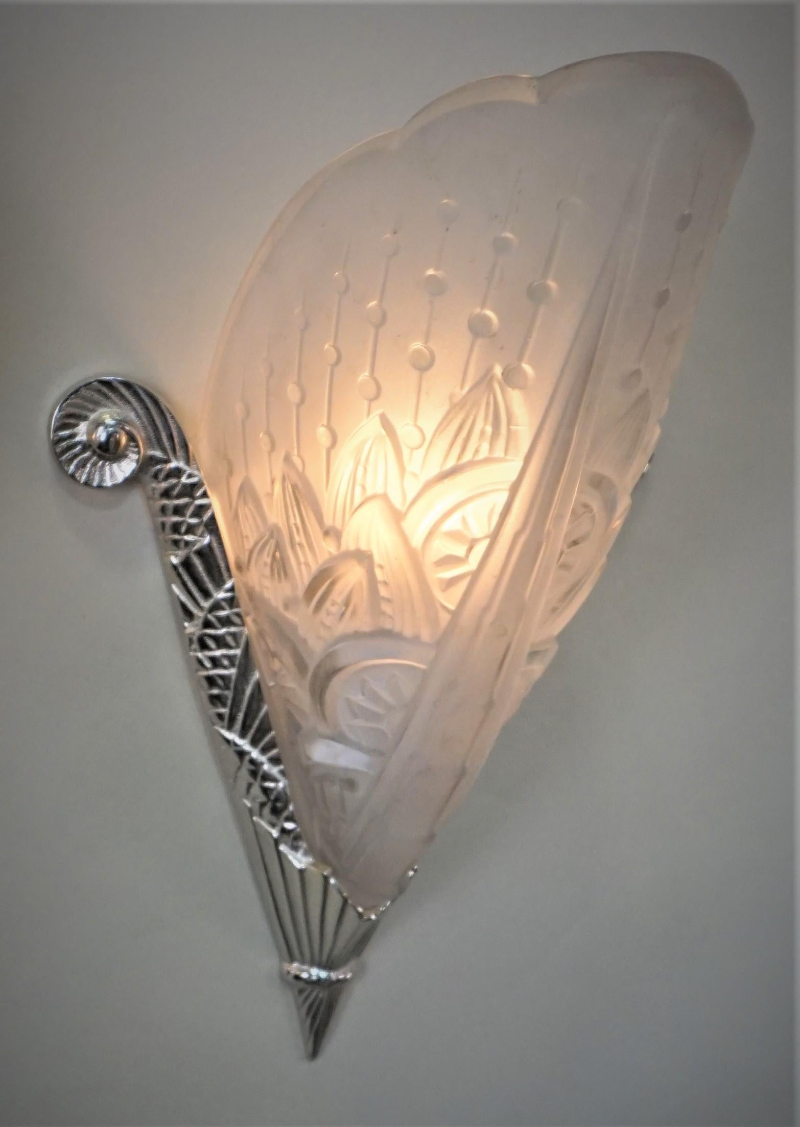 Pair of clear frost glass, nickel on bronze frame wall sconces by Lorrian Nancy.