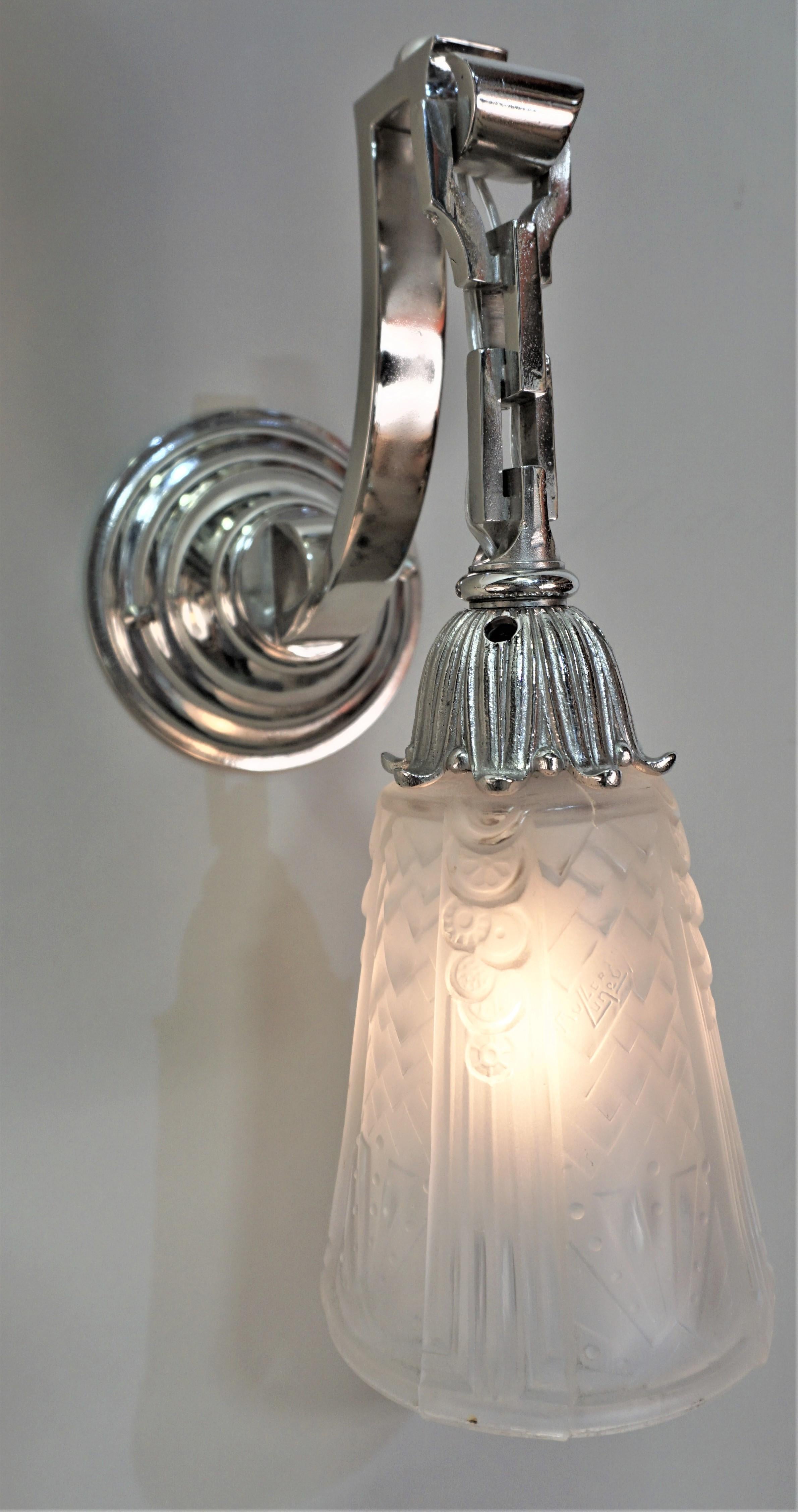 Clear frost beautiful design wall sconces with nickel on bronze frames.