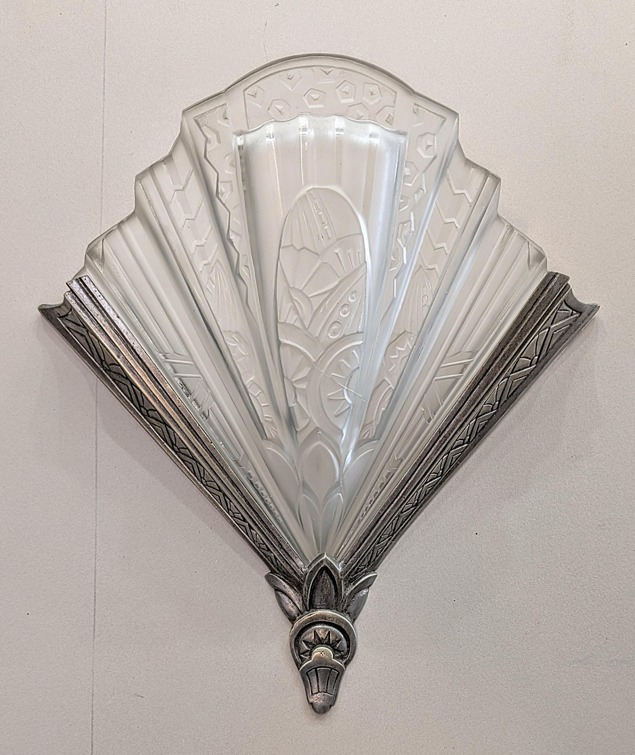 A pair of French Art Deco wall sconces signed 